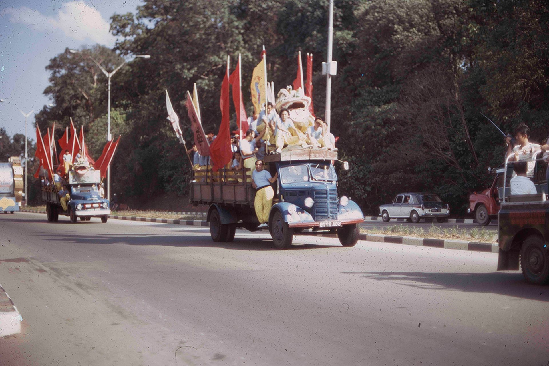 A lion dance troupe being transported by lorry to perform at different venues in the 1950s.