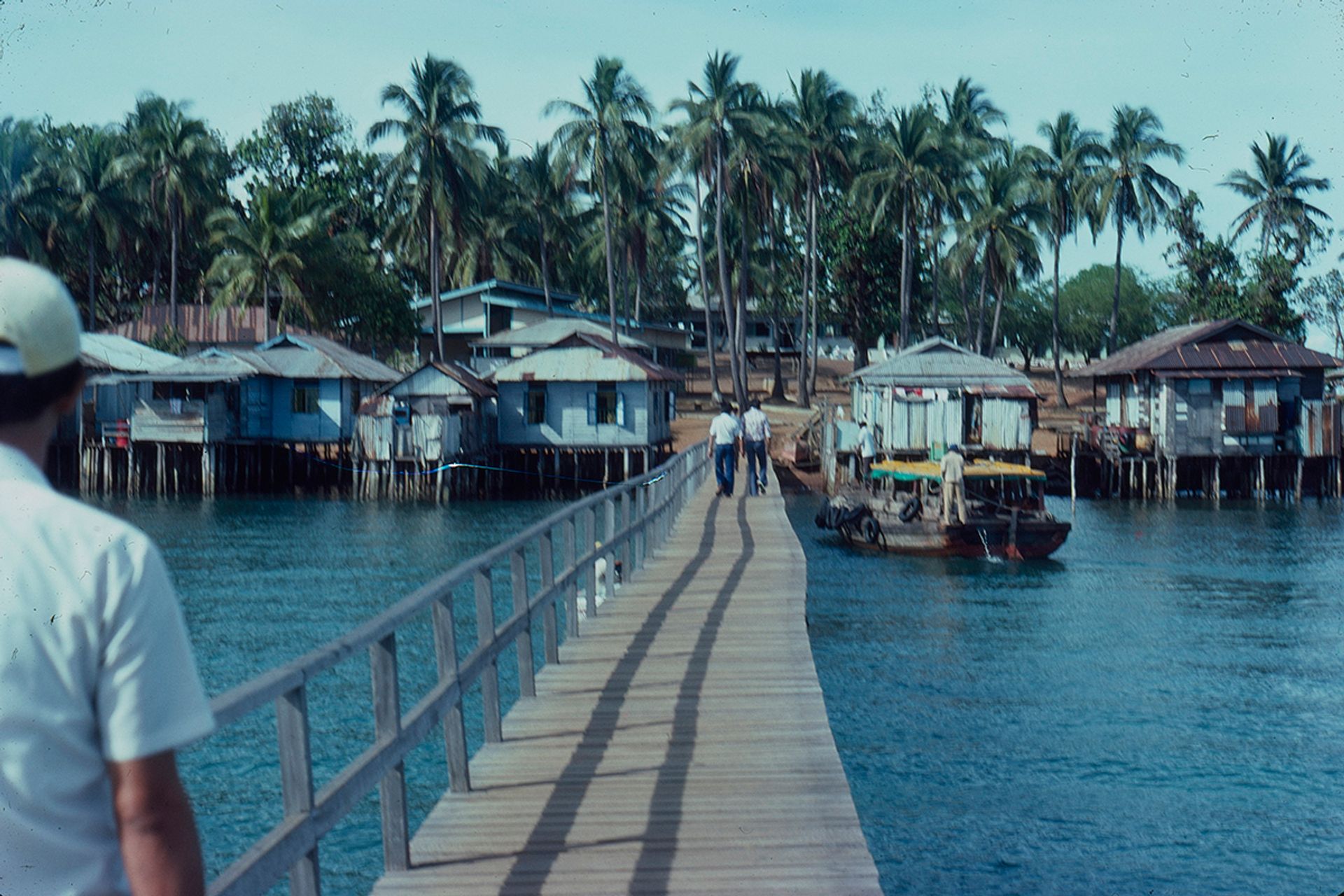 Pulau Seraya, with houses built on piles between tidemarks in the late 1960s. This island is now part of Jurong Island, dedicated to the petrochemical industry.