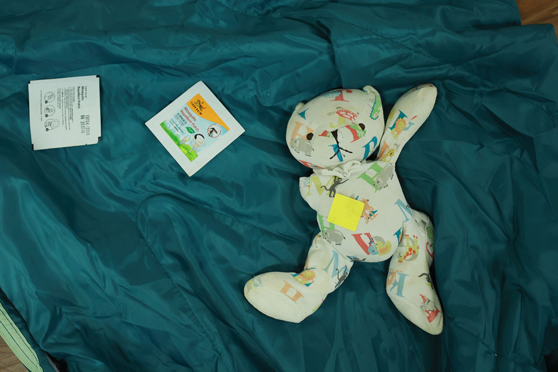 A mosquito repellent patch on a teddy bear in the lodge. Many of the children use the extra patches on their beloved soft toys to “protect” them against unwanted bites.