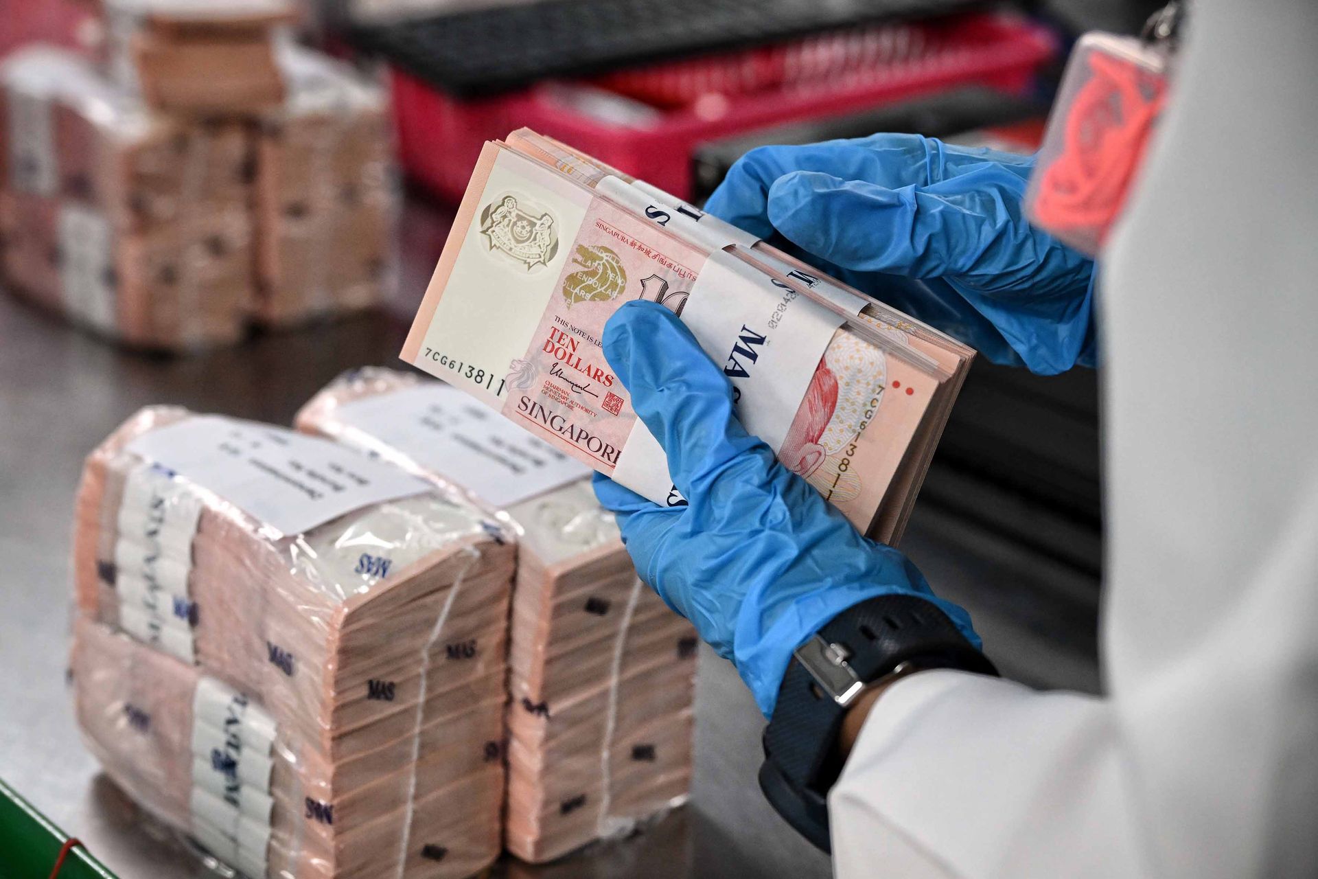 New notes from MAS arrive at Certis’ cash processing centre, where cash management officers make sure the sealed boxes have not been not tampered with.