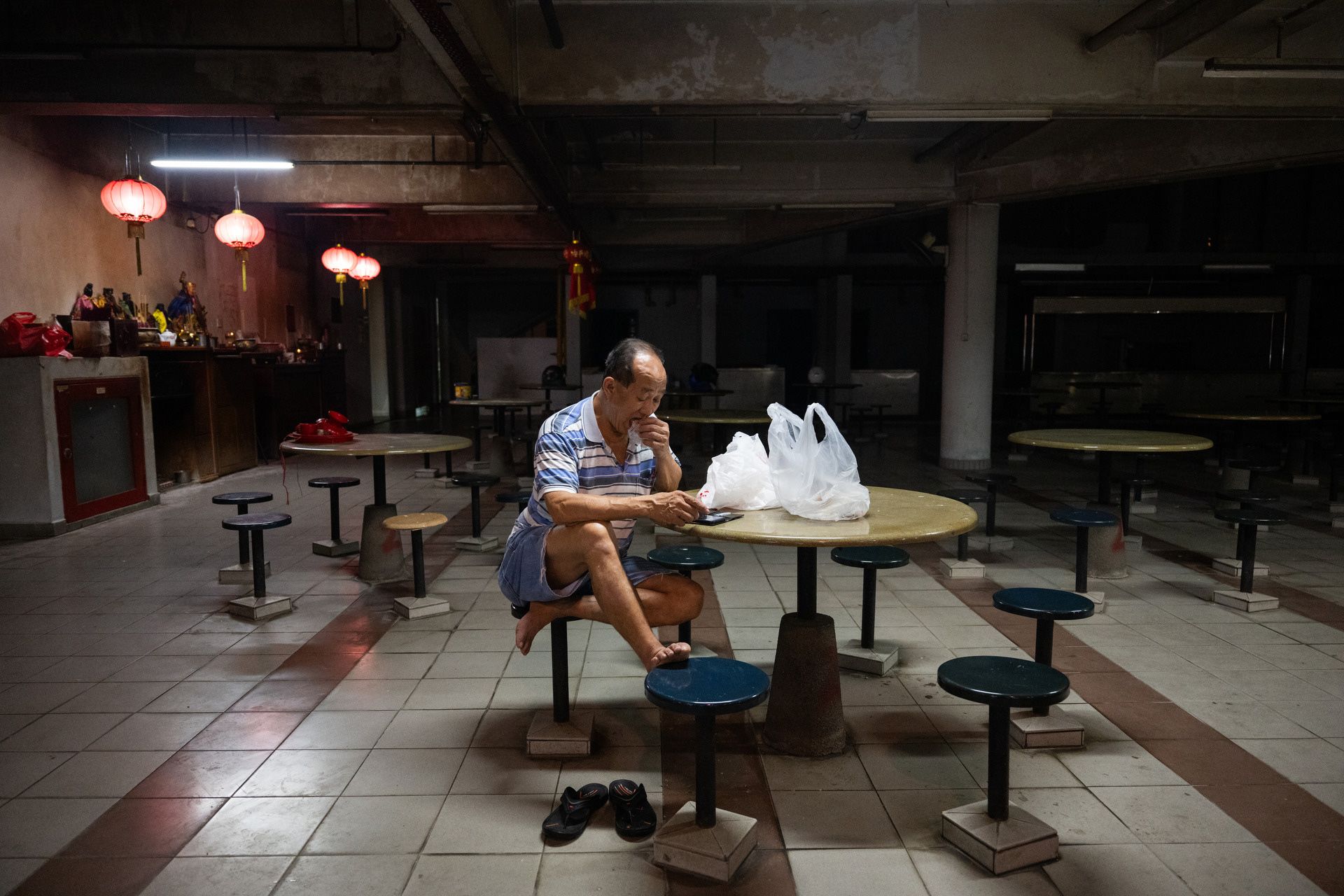Worker Low Swee Hua, 64, unwinding after the end of a long day at work in the now-defunct canteen, which was closed down as it was not profitable to run.