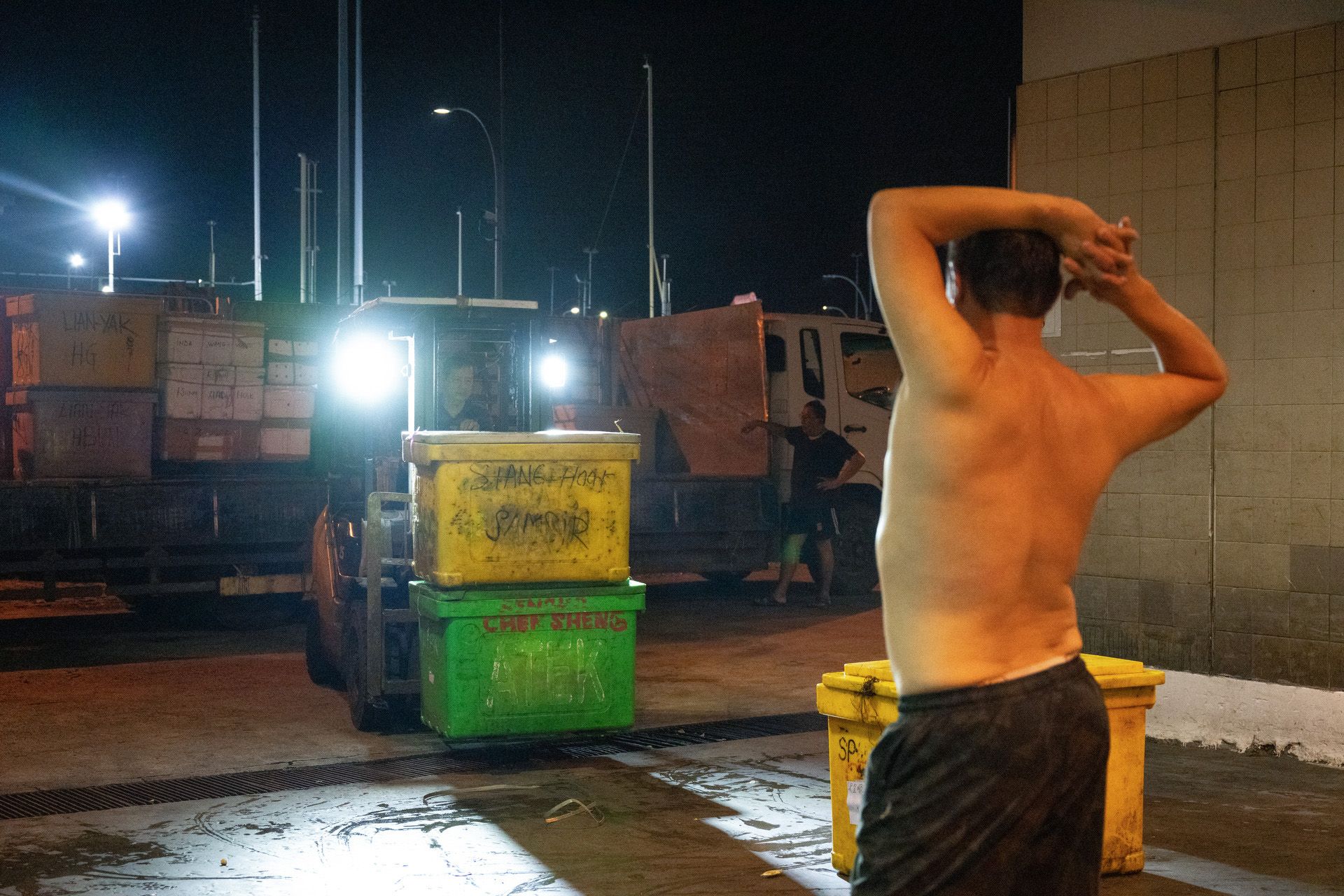 Fish merchant Ong Eng Boon, 58, getting a good stretch just before 3am on March 8 while waiting for the day’s seafood catch.