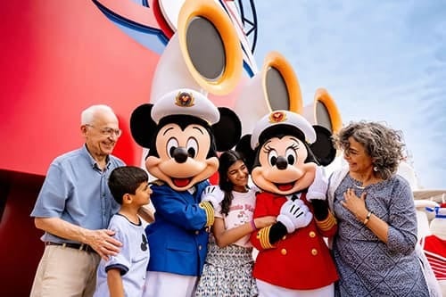 Family with Captain Mickey and Minnie Mouse on a Disney cruise.