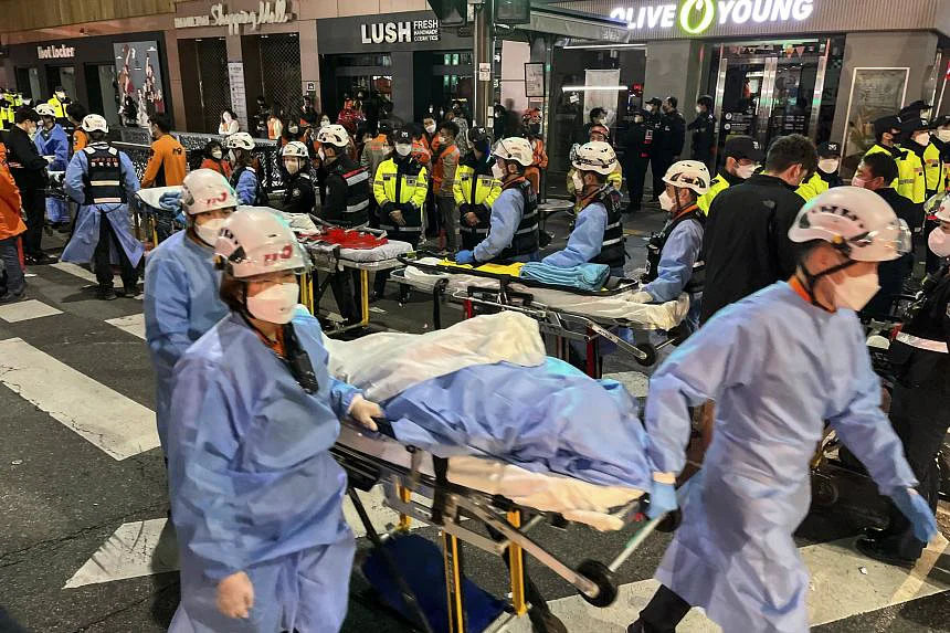 Emergency responders at the scene of the crowd surge. NYT