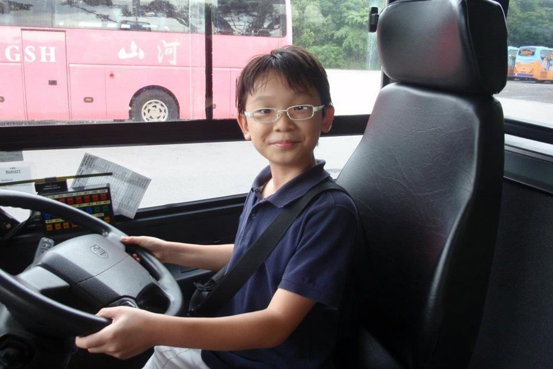 12-year-old Matthew Tay on a bus in Sentosa during an outing in 2011.