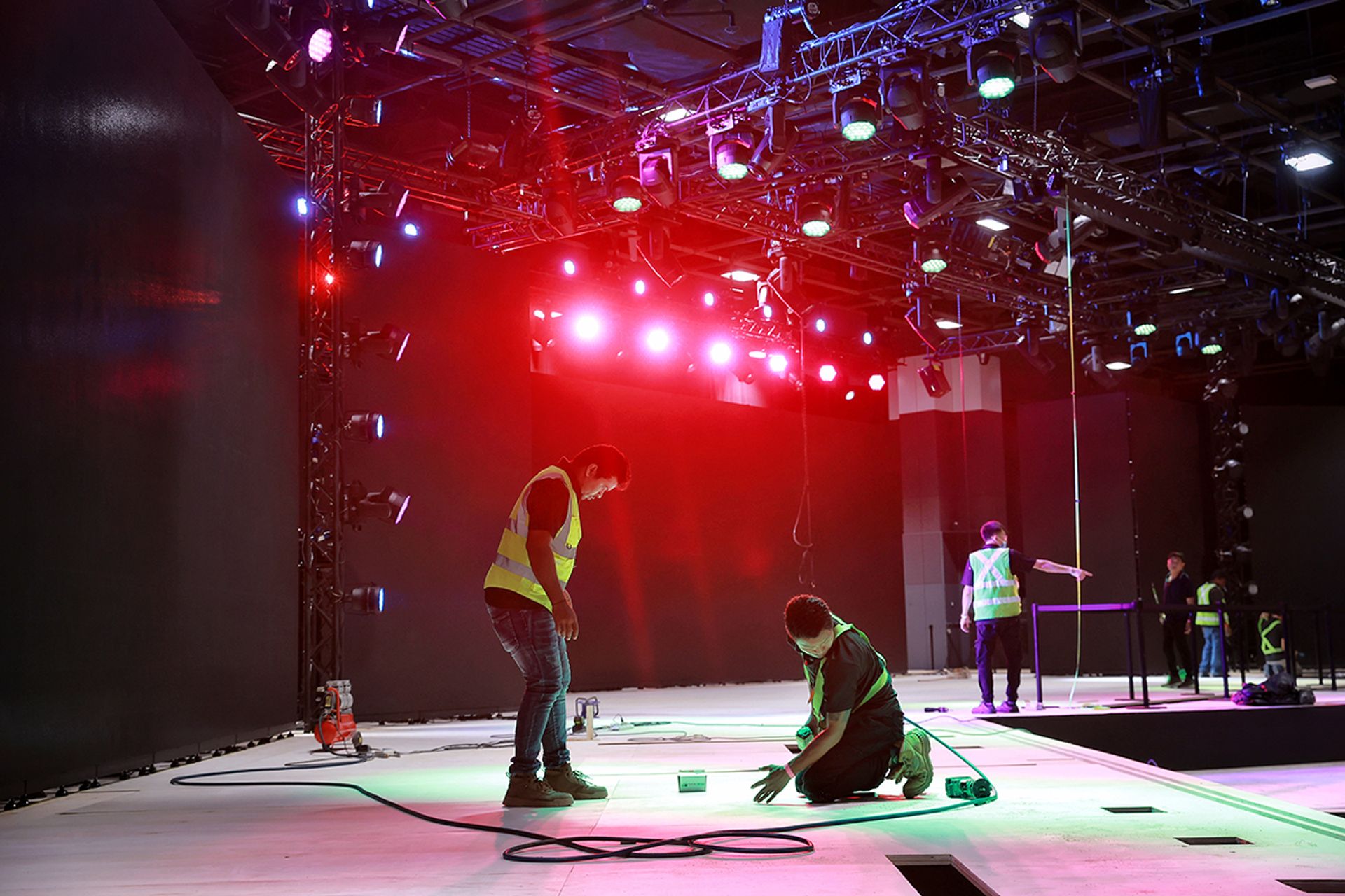 Workers getting the competition stage set.