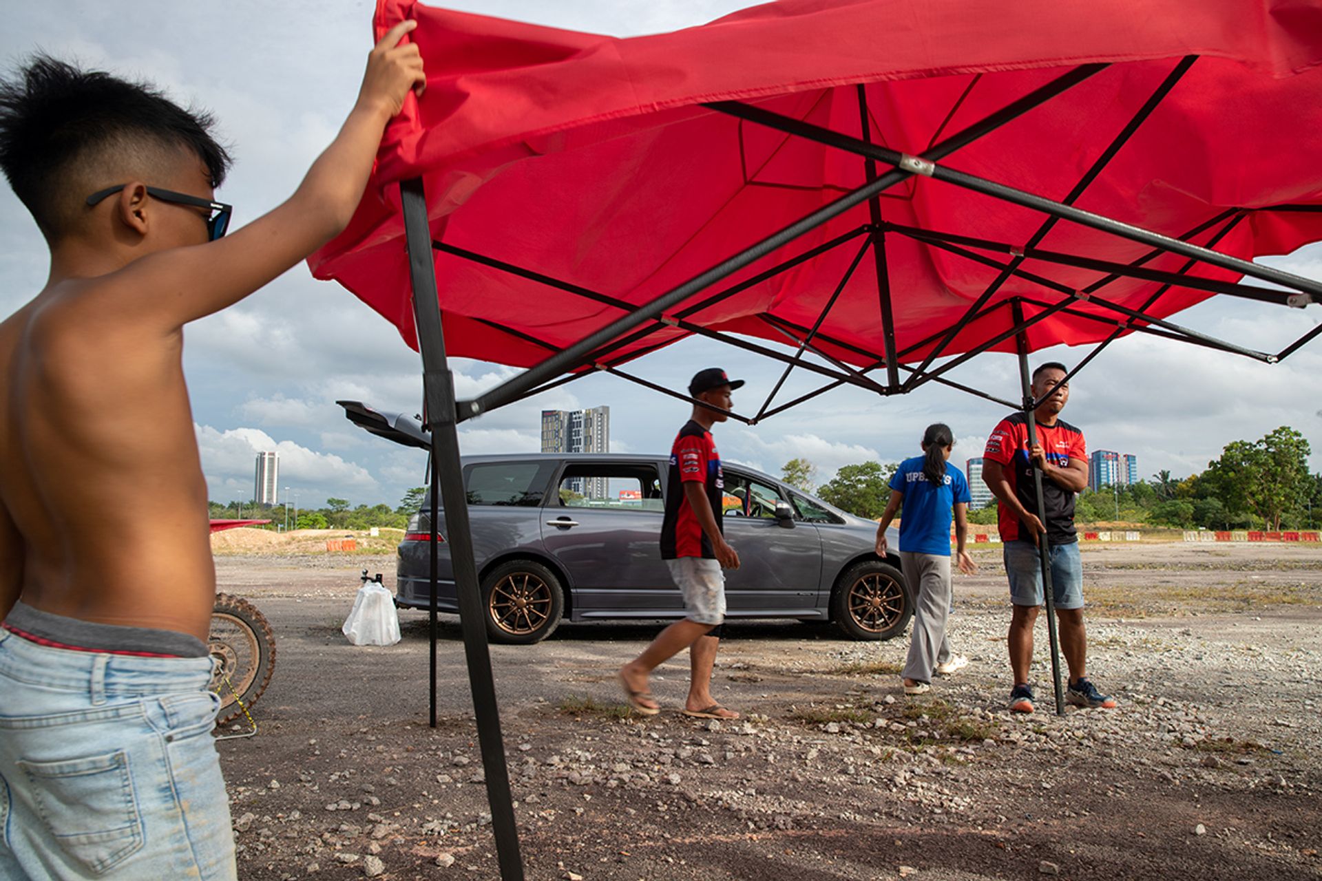 The family packing up their tents, tables, chairs and other equipment at the end of training on July 1.
