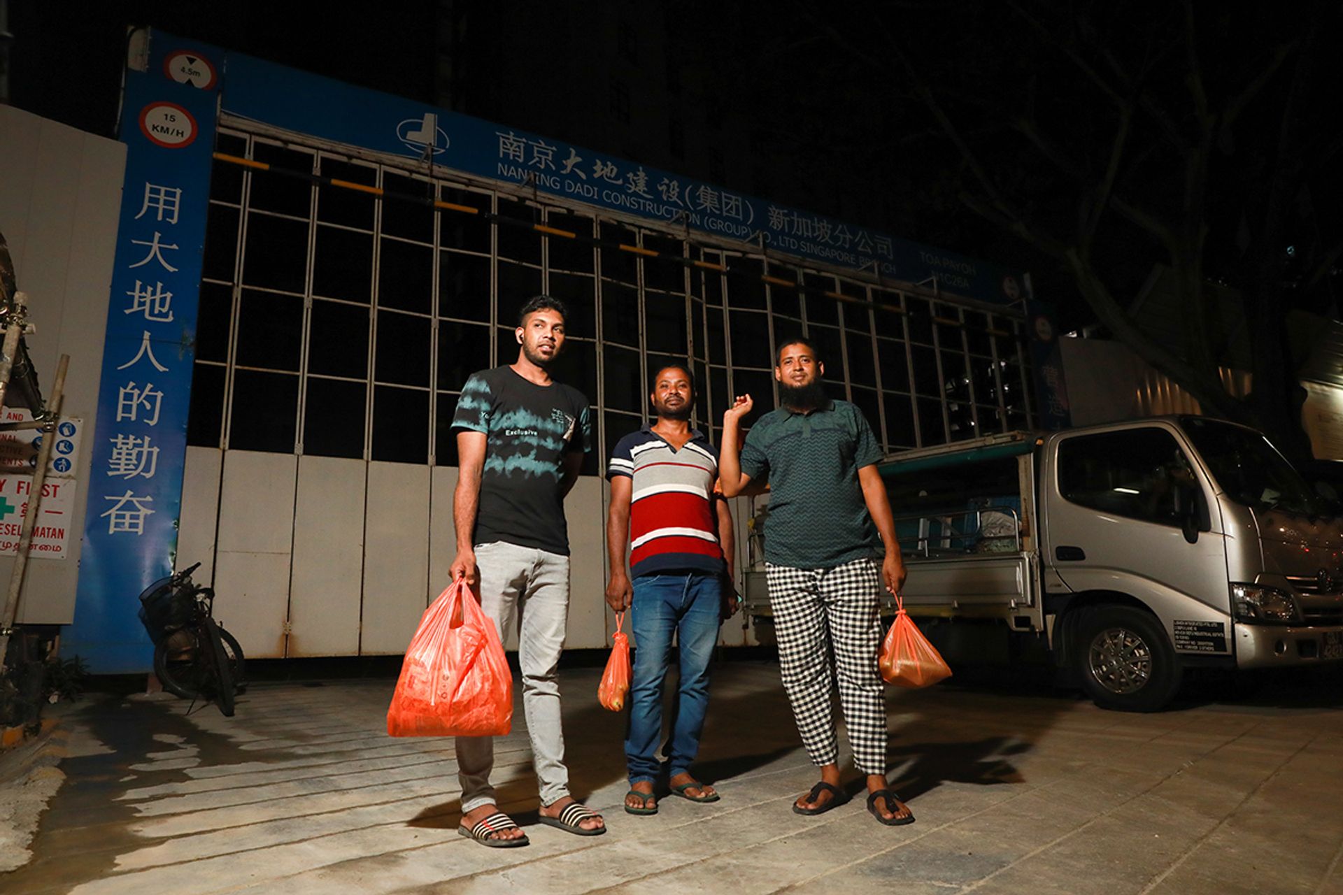 (From left) Plumber Islam Haiul, 24, electrician Ahad Ali, 37, and driver Sheikh Shakil, 30, spend about $20 each for their weekly supply of vegetables.