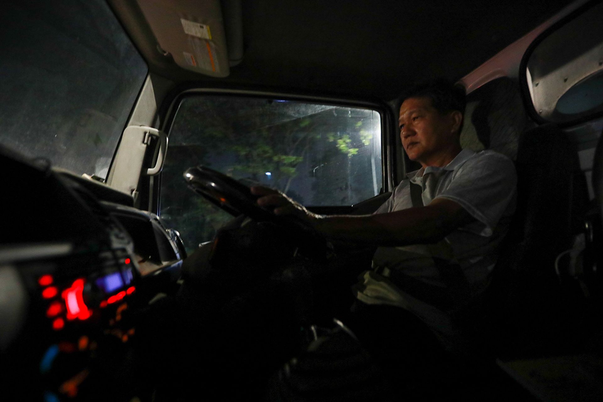 Mr See driving to Toa Payoh in his lorry to begin his night at the market on April 17, 2023.