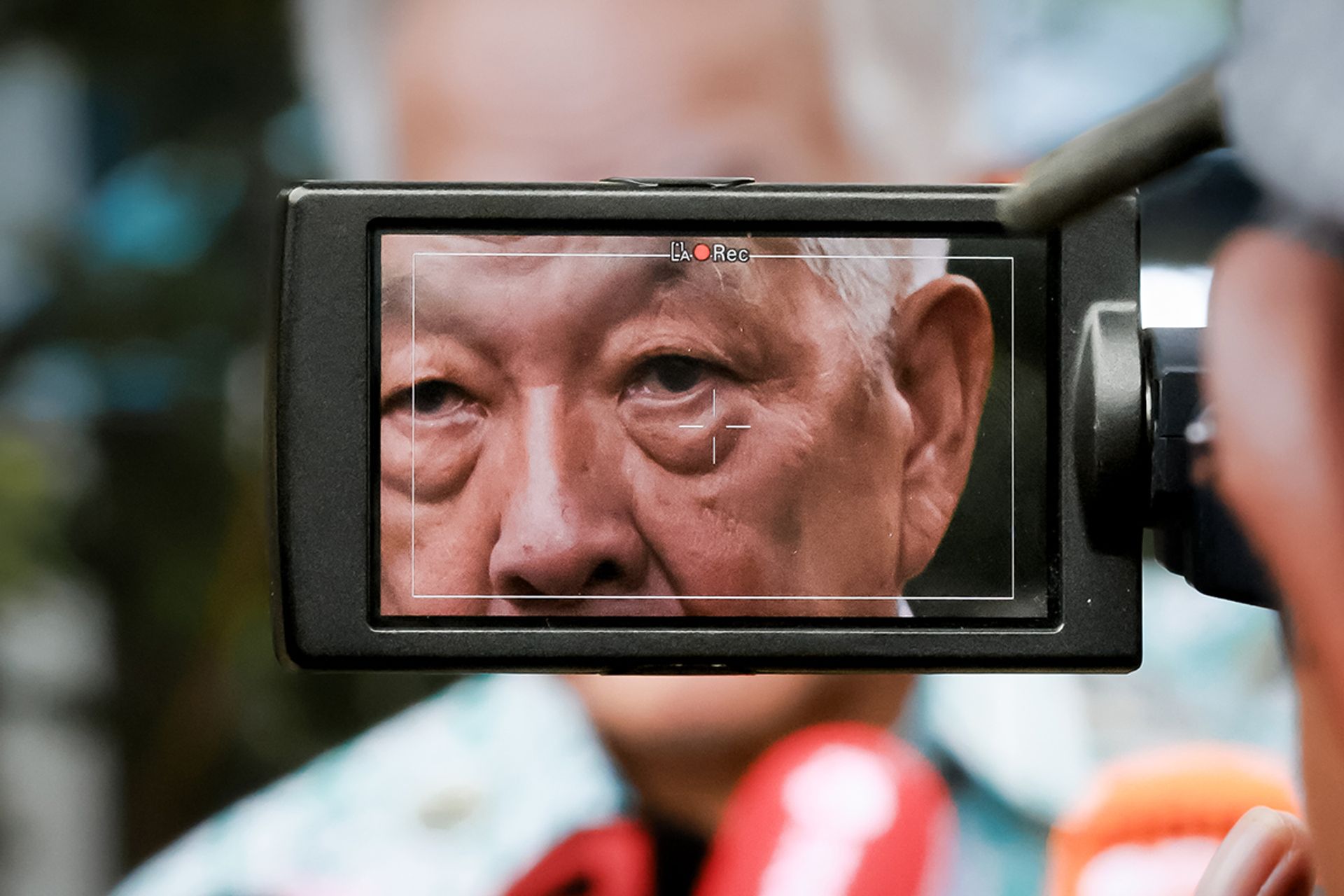 Mr Ng speaking to the media during a visit to Ayer Rajah Food Centre on Aug 28, 2023. ST PHOTO: GAVIN FOO