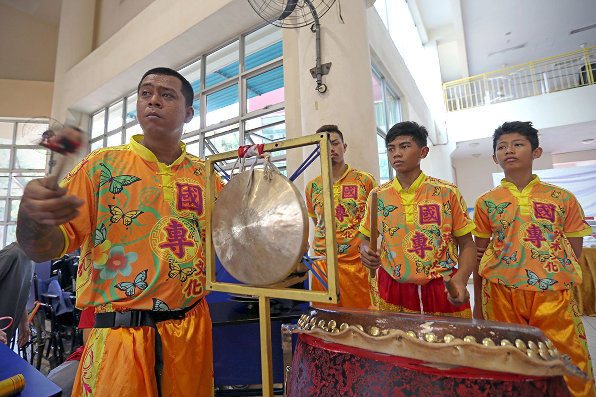 Jashairie Jamsairi (second from right) playing the drums during a performance held at Thye Hua Kwan Moral Society in 2017.  ST FILE PHOTO: NEO XIAOBIN