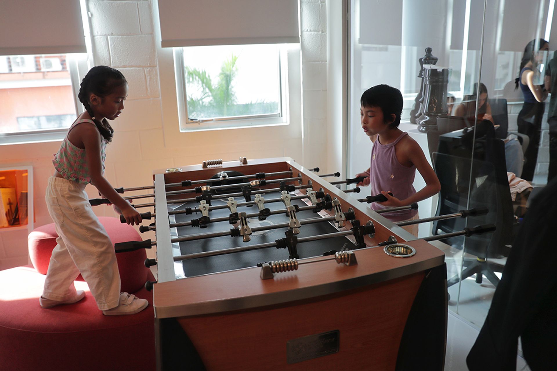 Leukaemia survivor Charlie Rose (right), relaxed with her sister Dahlia Jaymes, six, in the offices of Oceanus Media Global before they walked the runway.