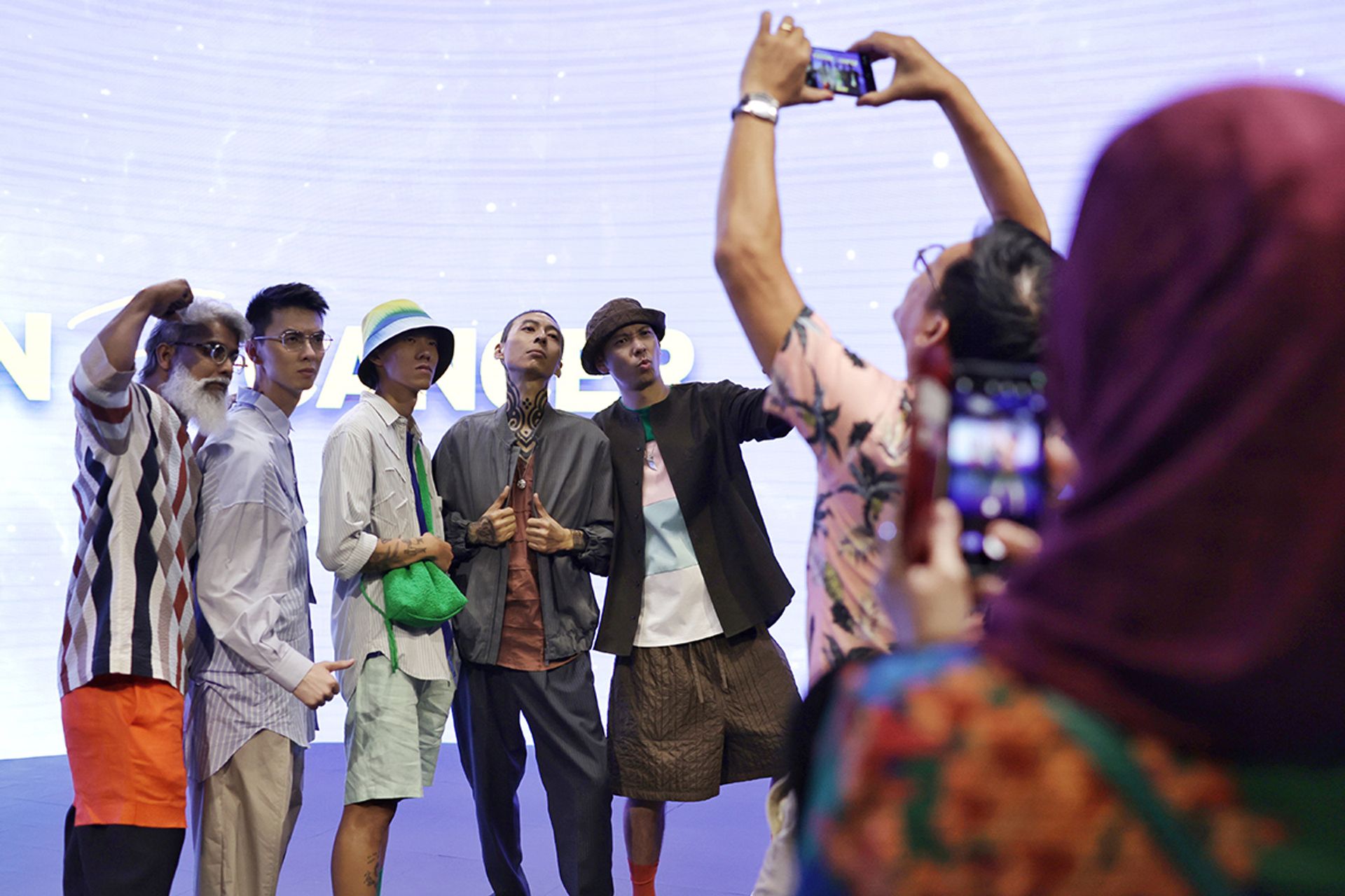 Show participants (from left) Mr Arun Rosiah, Mr Tay Zhi Zhong, Mr Gabriel Yip, Mr Chia Rong Liang and Mr Nicky Loh posed for photographs on stage.
