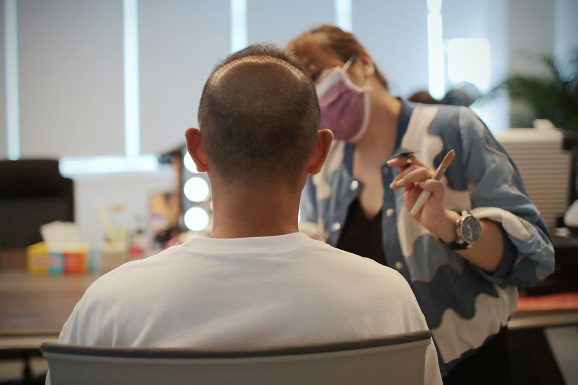 Photographer Nicky Loh, 41, who survived two bouts of lymphoma, had his make-up done before modelling.