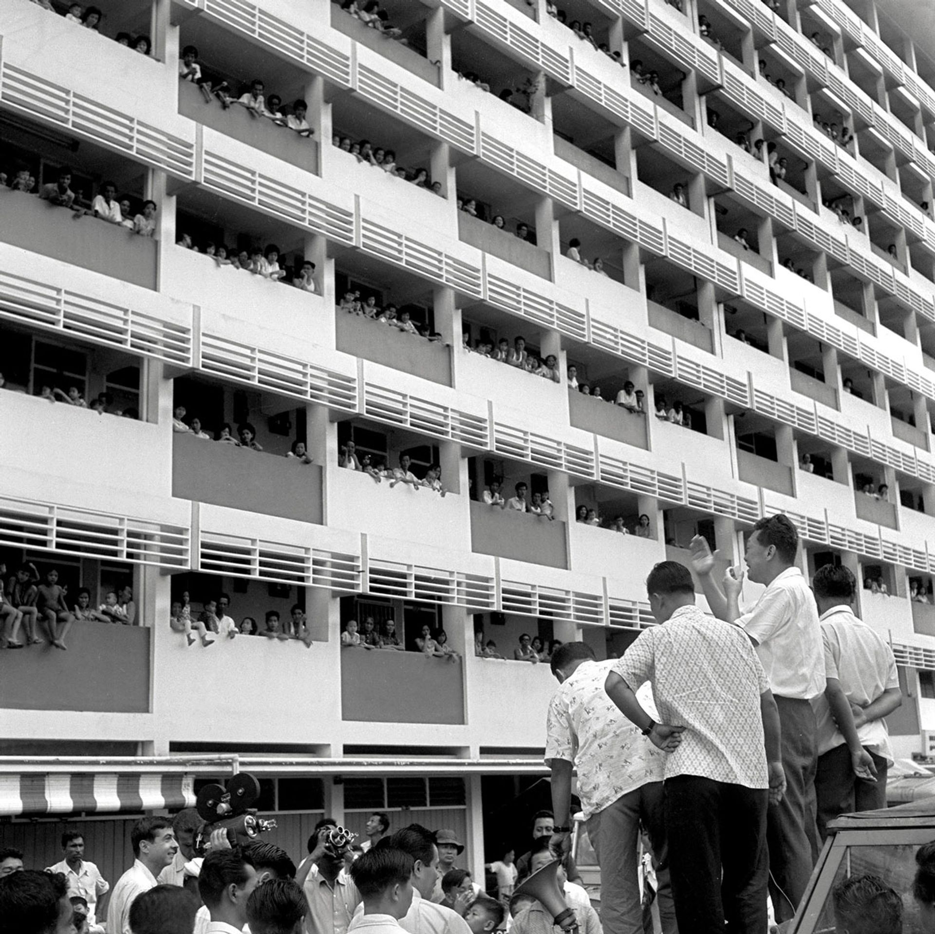 Mr Lee (second from right) urging Cantonment Road residents to quash all talk of communal hatred, bitterness or revenge on July 26, 1964, after racial riots broke out five days earlier. Everyone wanted to live in peace and friendship, he assured them. ST Photo: Mak Kian Seng