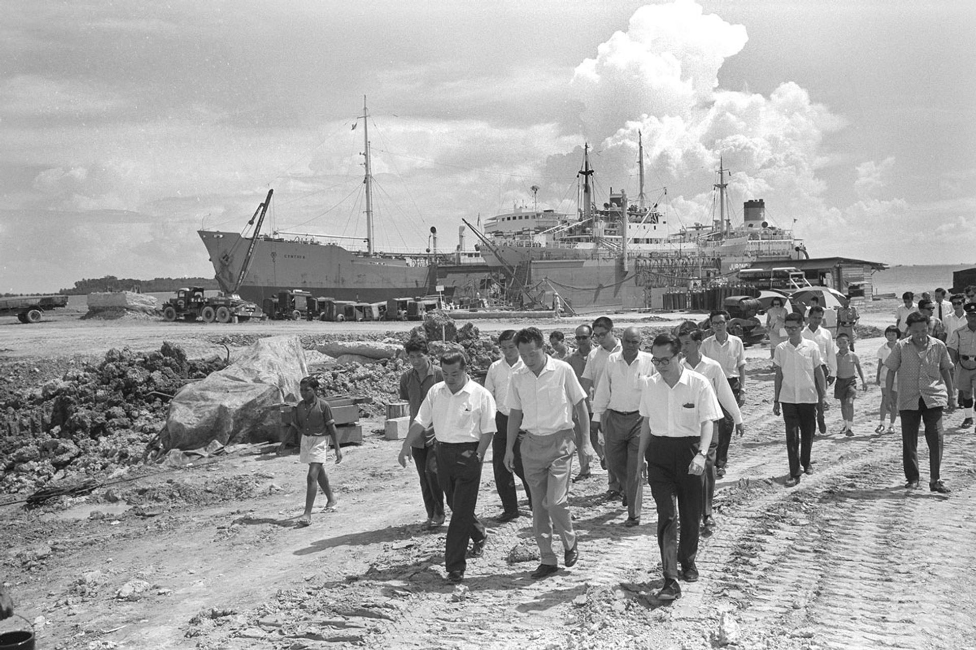 Mr Lee (centre) at Jurong port on May 2, 1965, with Economic Development Board chairman Hon Sui Sen (right, in glasses). Jurong’s deep coastal waters made it suitable for a port, which became operational that year. ST Photo: Han Hai Fong