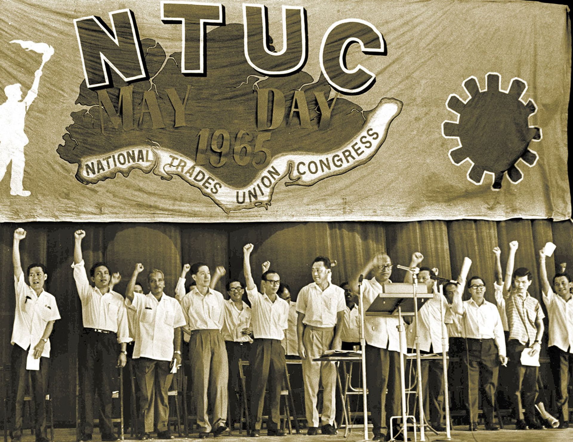 The trade union movement was a key partner to the Government in the economic development of Singapore. The National Trades Union Congress played a leading role in this, led by its founding leader, Mr C.V. Devan Nair, seen here on stage with Mr Lee (left of Mr Nair) at the NTUC May Day Rally in 1965. Source: Lee Kuan Yew