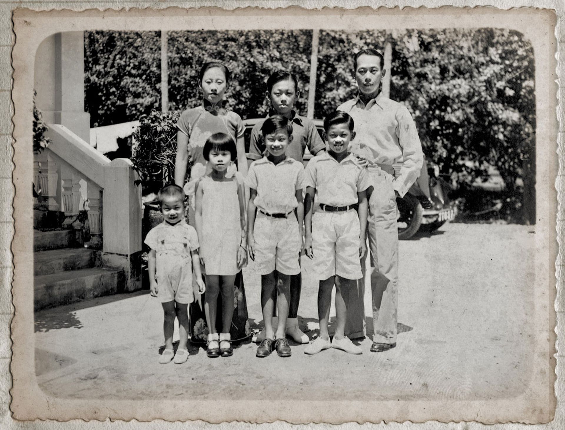 Lee Kuan Yew (back row, centre) outside his Norfolk Road home in 1936 with siblings (front, from left) Suan Yew, three; Monica, seven; Freddy, nine; and Dennis, 11; and parents Chua Jim Neo, 29; and Lee Chin Koon, 33. Source: Lee Suan Yew