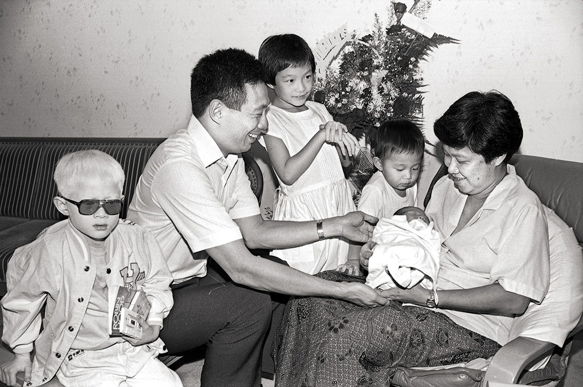 Mr Lee Hsien Loong and Ms Ho Ching, with children (from left) Yipeng, Xiuqi and Hongyi, welcoming baby Haoyi to their family on March 7, 1989. Mr Lee married Ms Ho, then an engineer with the Ministry of Defence, on Dec 17, 1985. ST Photo: Wan Seng Yip