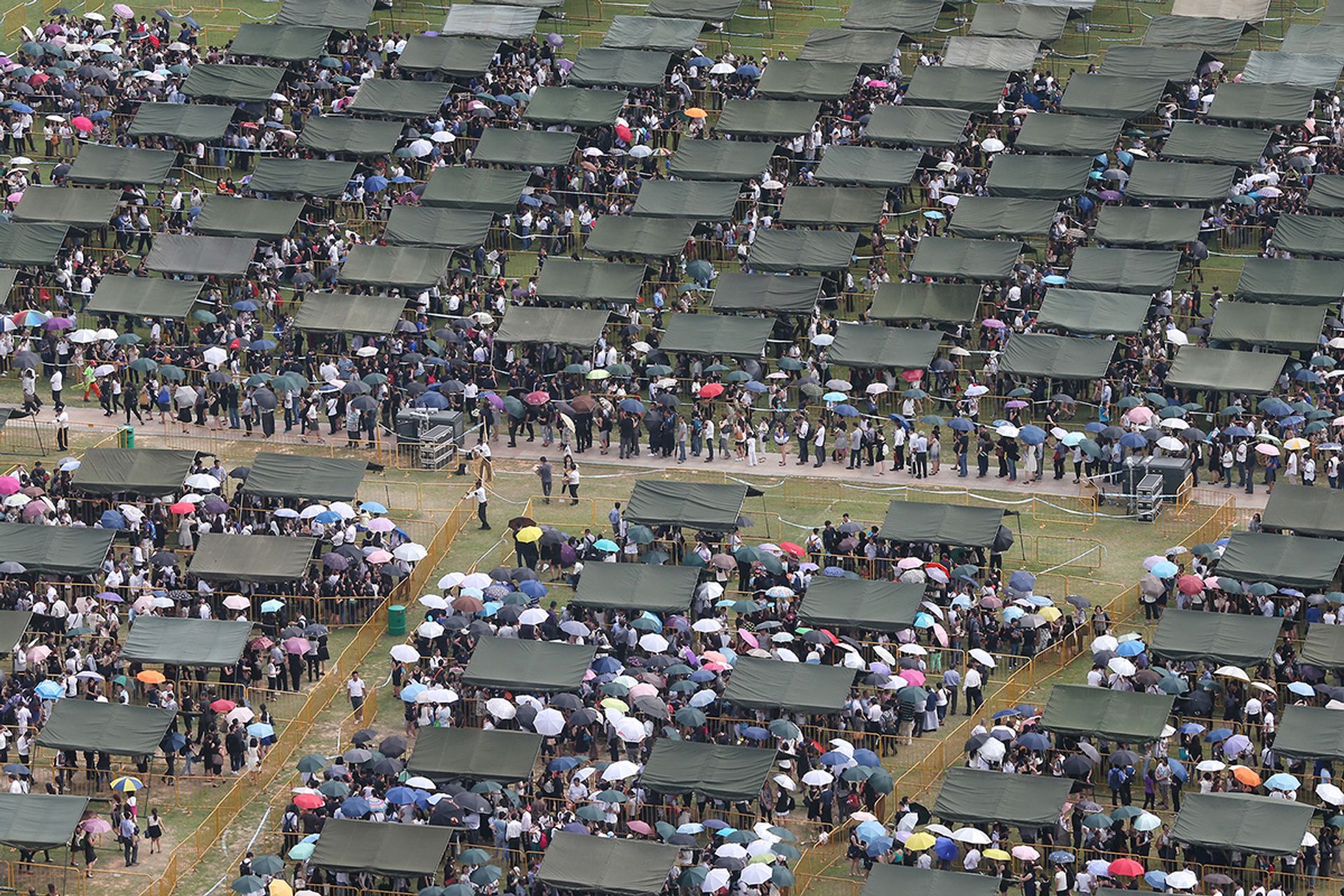 When Mr Lee died on March 23, 2015, nearly half a million people queued for hours over four days at the Padang to pay their last respects to their much-loved and admired leader, lying in state at Parliament House. The Singapore Armed Forces erected some 300 tents to provide shelter under the scorching sun. ST Photo: Neo Xiaobin