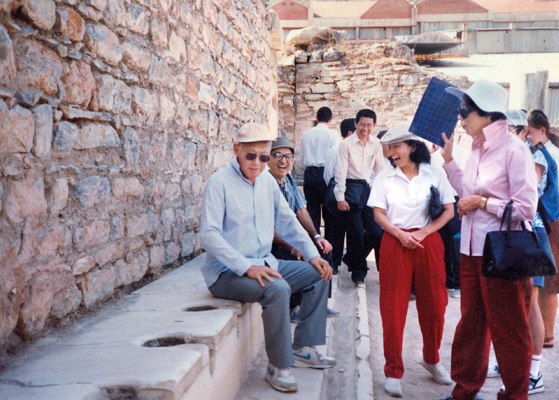 Getting a feel for the ancient public toilets in Turkey, Mr Lee amuses Mrs Lee (right); Ms Ling Siew May (second from right), wife of Deputy Prime Minister Ong Teng Cheong; and other Singapore officials during his visit to the republic in September 1991. Source: Lee Kuan Yew