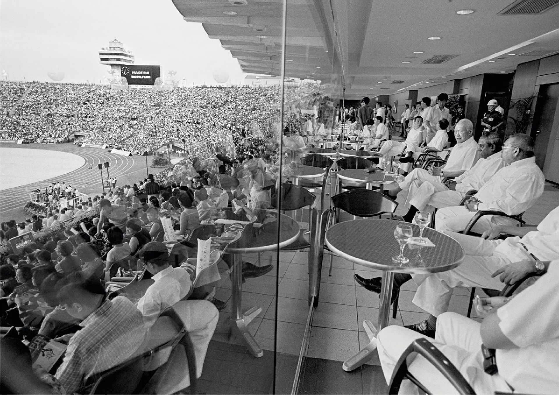 Enjoying the parade from the comfort of the VIP lounge with his parliamentary colleagues before they made their public entrance into the National Stadium on Aug 9, 2001. ST Photo: George Gascon
