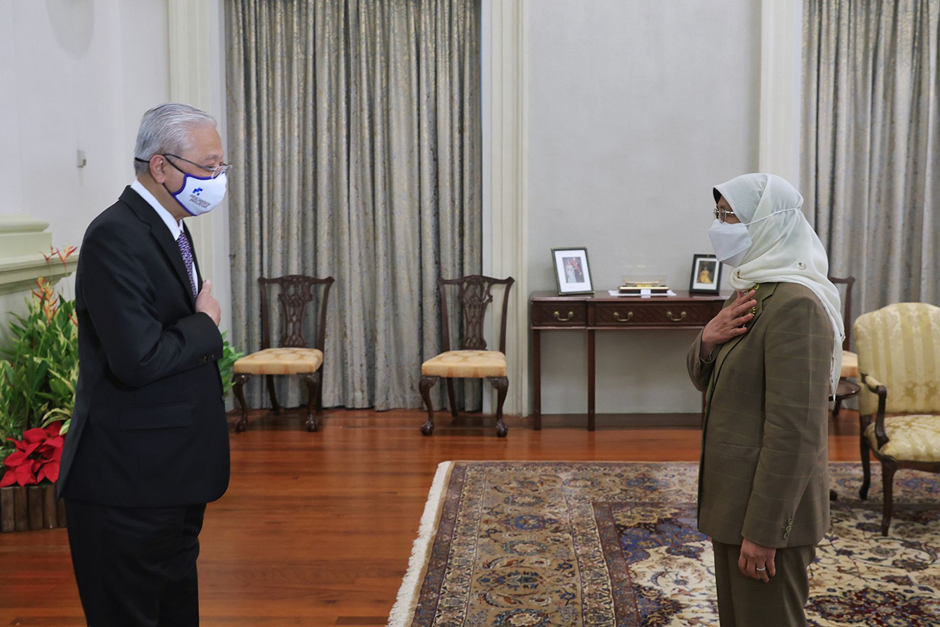 Then Malaysian Prime Minister Ismail Sabri Yaakob (left) calling on President Halimah during his visit to the Istana on Nov 29, 2021. ST PHOTO: KEVIN LIM