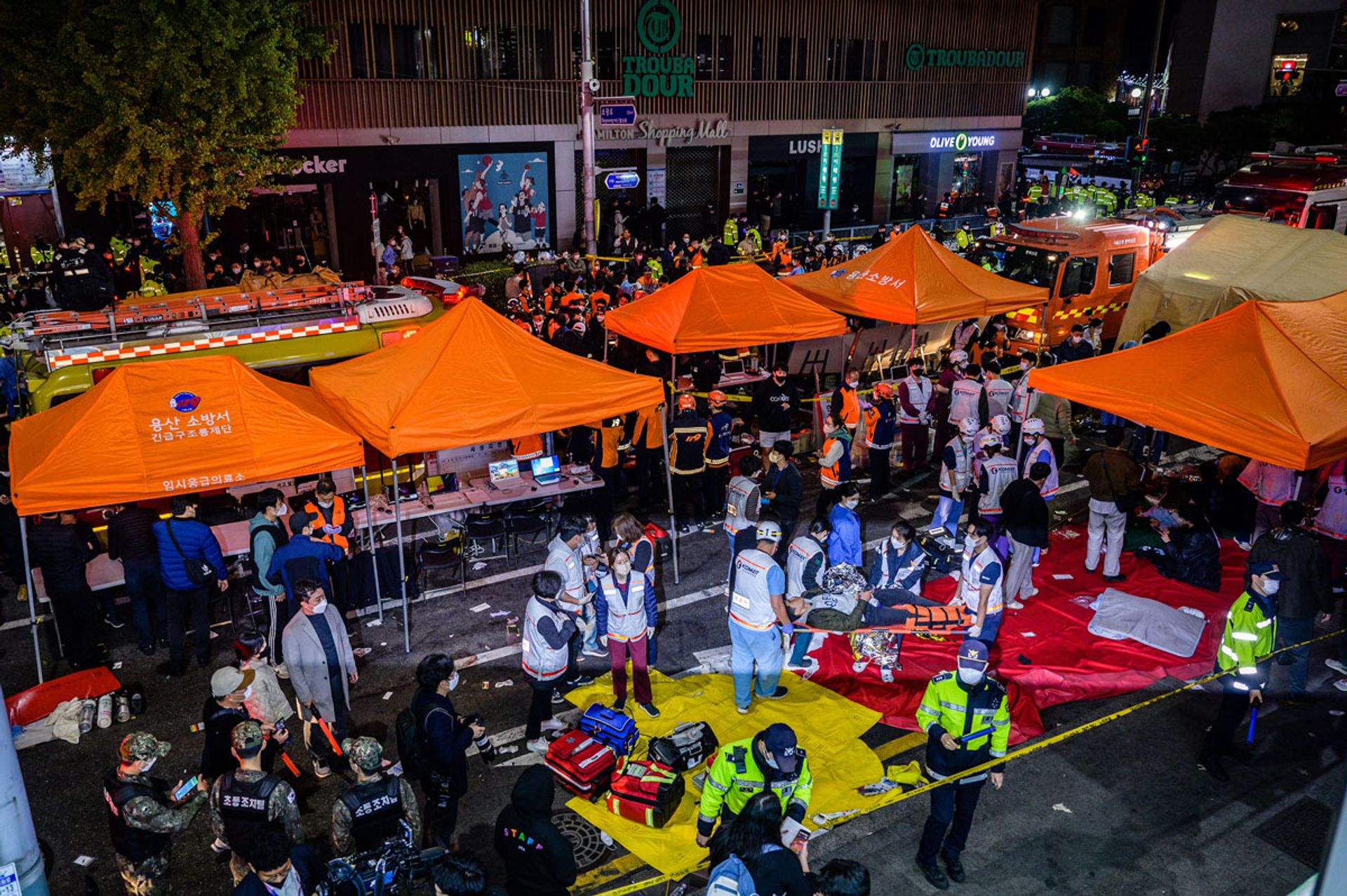Rescue workers providing aid and support after the crowd crush that took place on Oct 29, 2022, in the popular district of Itaewon in Seoul. PHOTO: AFP