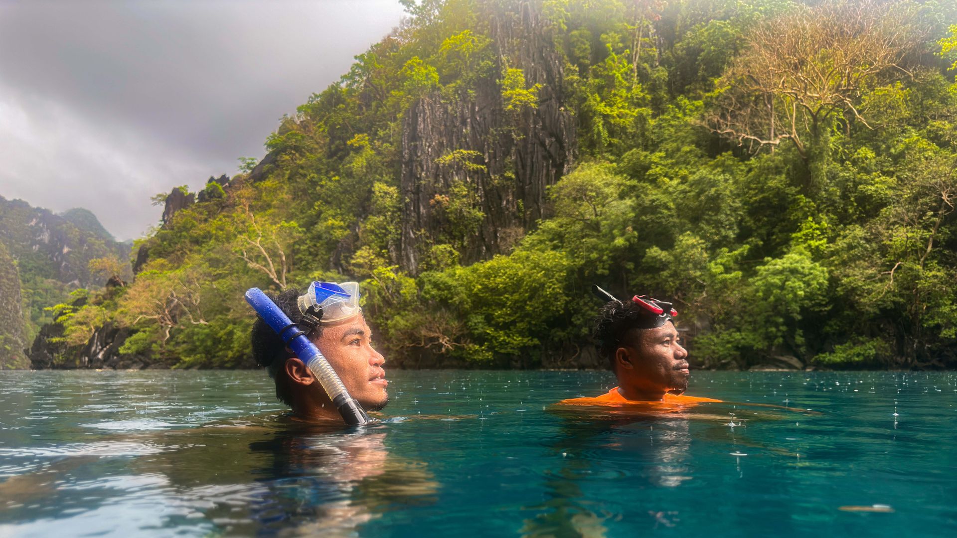 Lifeguards Marco Aguilar (right) and Vhener Abella observing tourists swimming in the lake. PHOTO: VINA SALAZAR