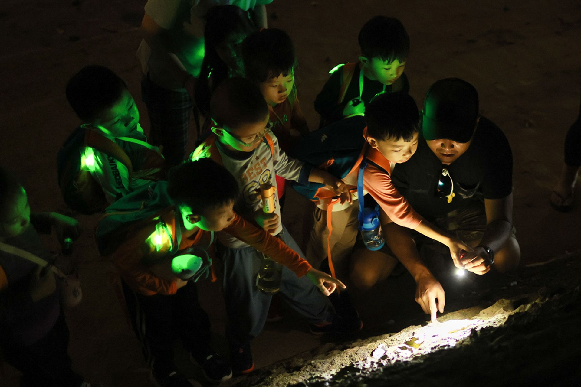 Children explore nocturnal wildlife to observe and learn about the fragility of our lands at the breakwater along the beach during low tide on Sept 21.