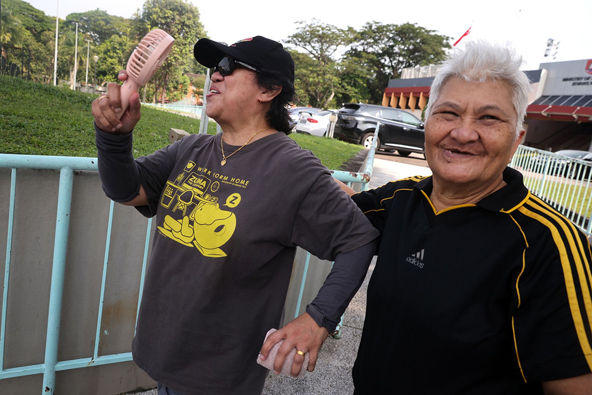 Madam Maimun Wahab and Madam Rogayah (wearing a cap) are all smiles before training.