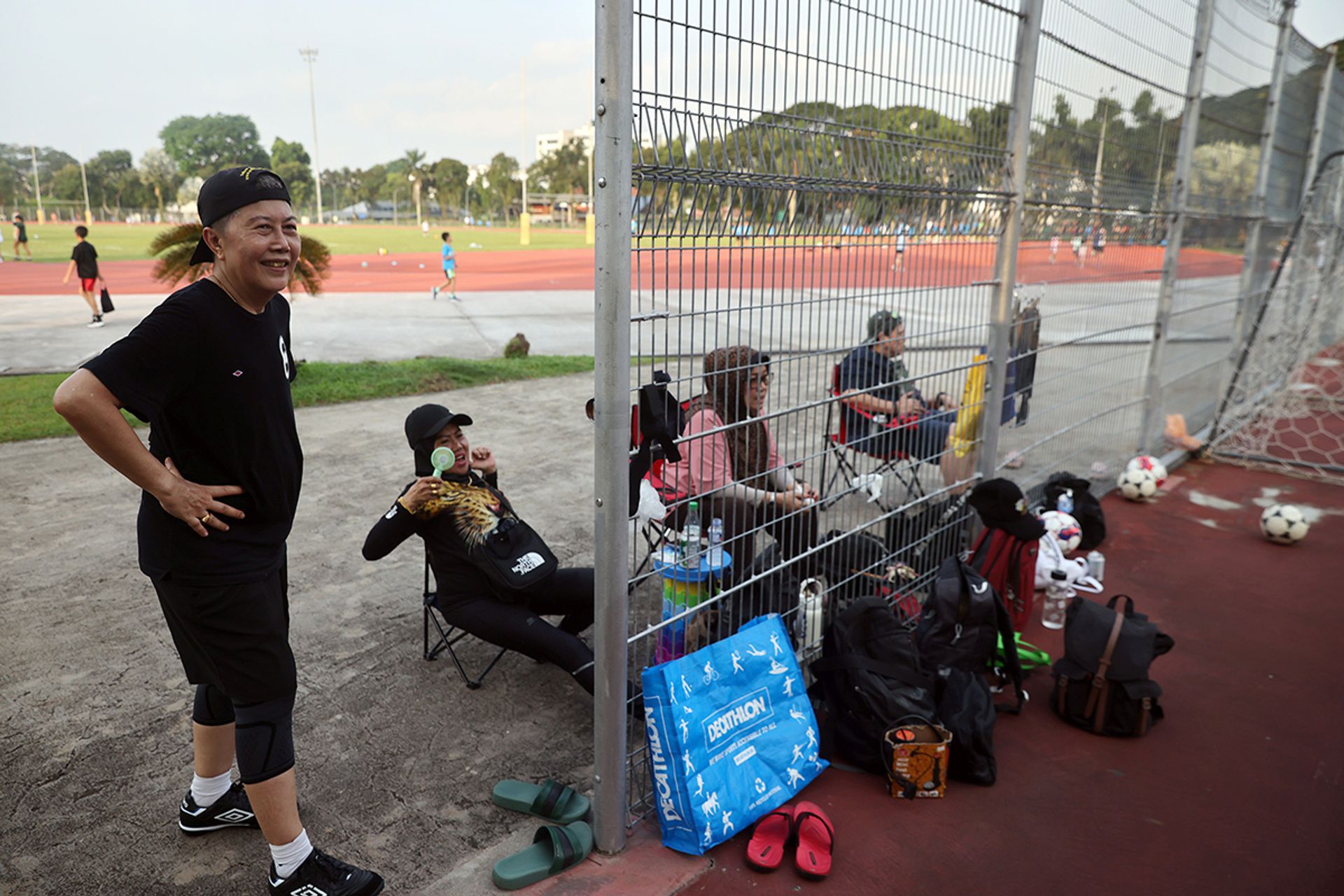 Team members cheering from the sidelines for those who are playing.