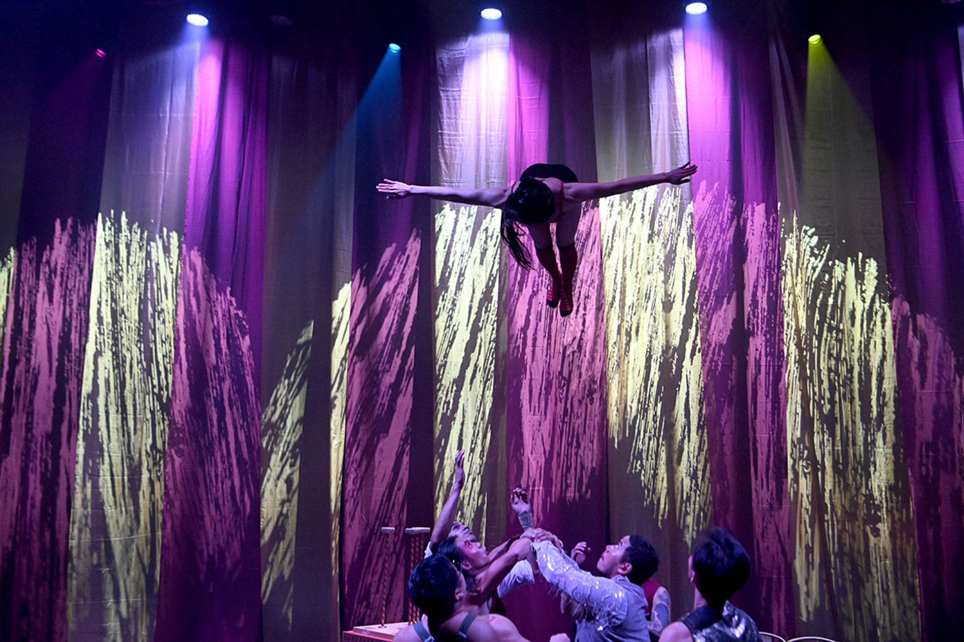 Ms Wan being tossed in the air while performing a somersault at a dizzying speed during a full-dress rehearsal.