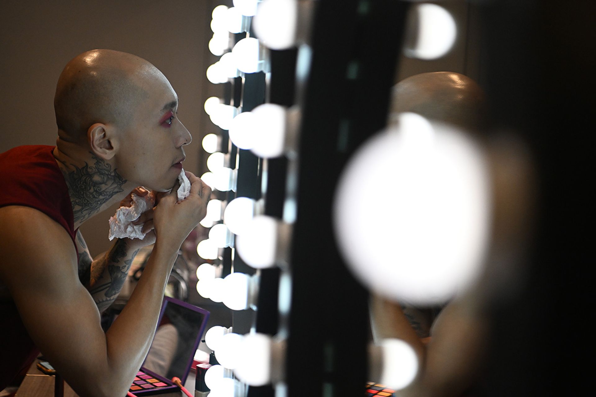 Multidisciplinary performer Gaz Leong putting on make-up before one of the last full-dress rehearsals at the Gateway Theatre.