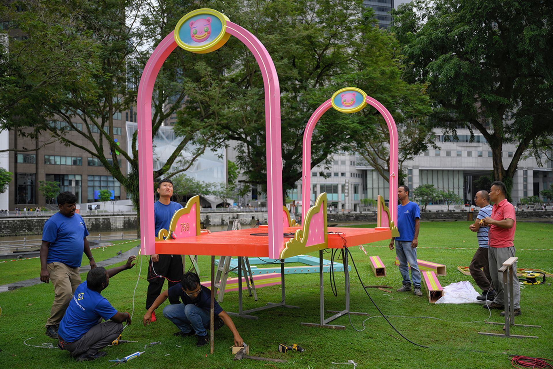 Workers putting together artist Howie Kim’s installation Party Pavilion, sited at the Asian Civilisations Museum Green.
