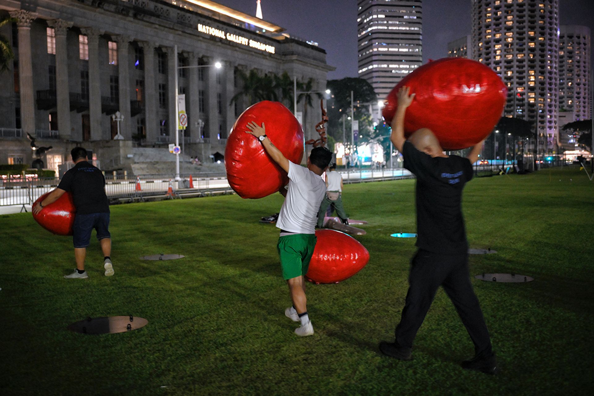 Inflatable saga seeds for artist Kumari Nahappan’s installation Wings of Change being moved during set-up at the Padang.
