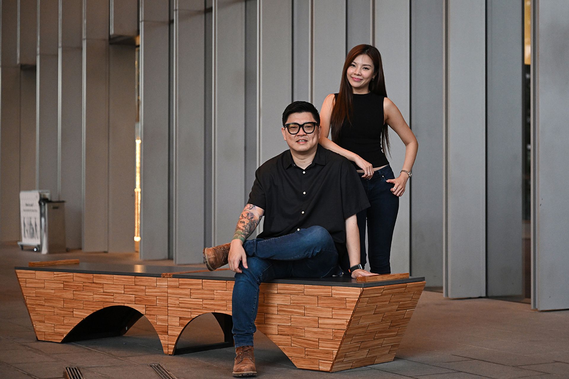 Husband-and-wife duo Justin Lee and Evelyn Hew with a bench ChopValue Singapore made for DUO, an integrated mixed-use development located in the Ophir-Rochor district.