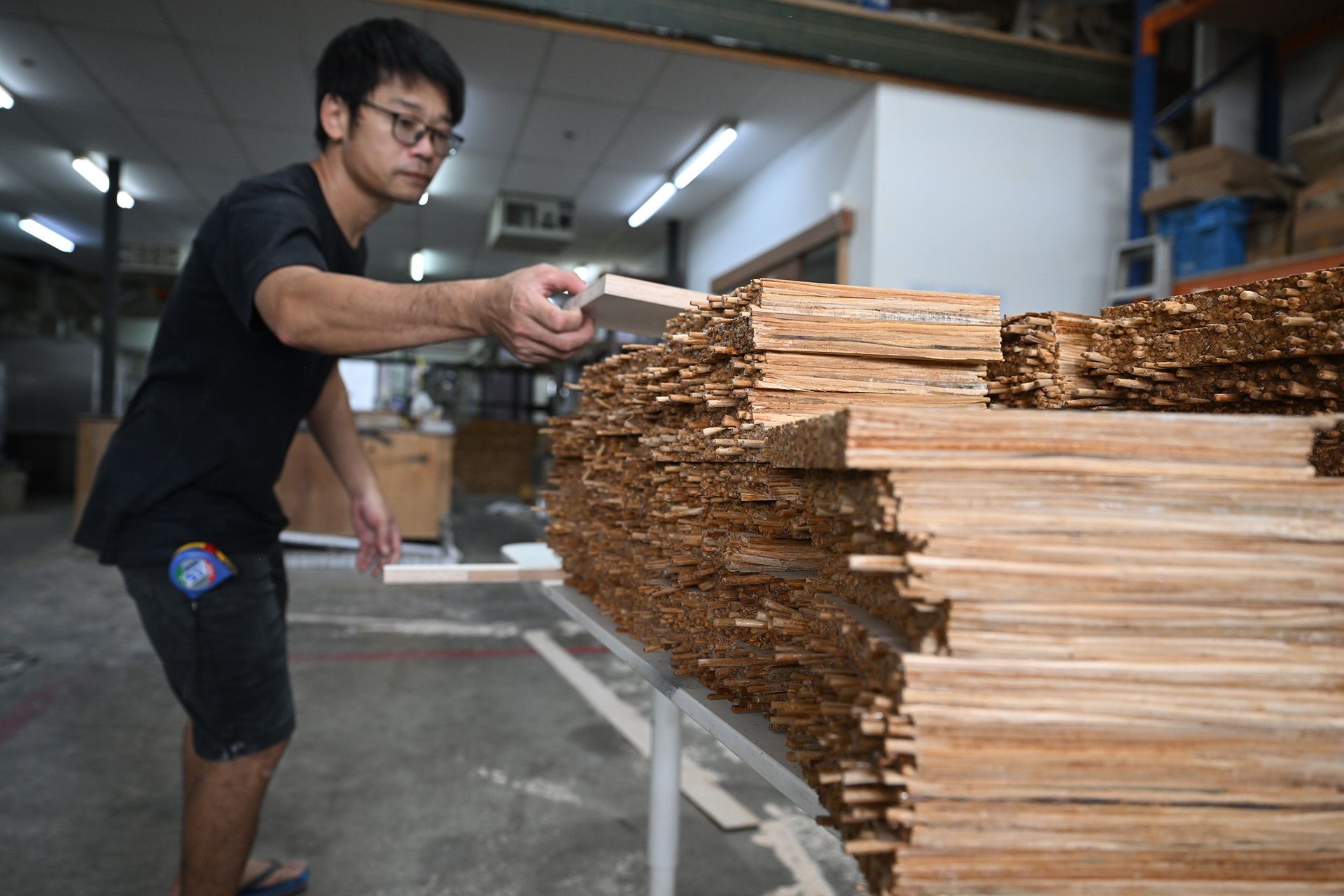 Next, the tiles are stacked in neat piles at the Loyang microfactory.