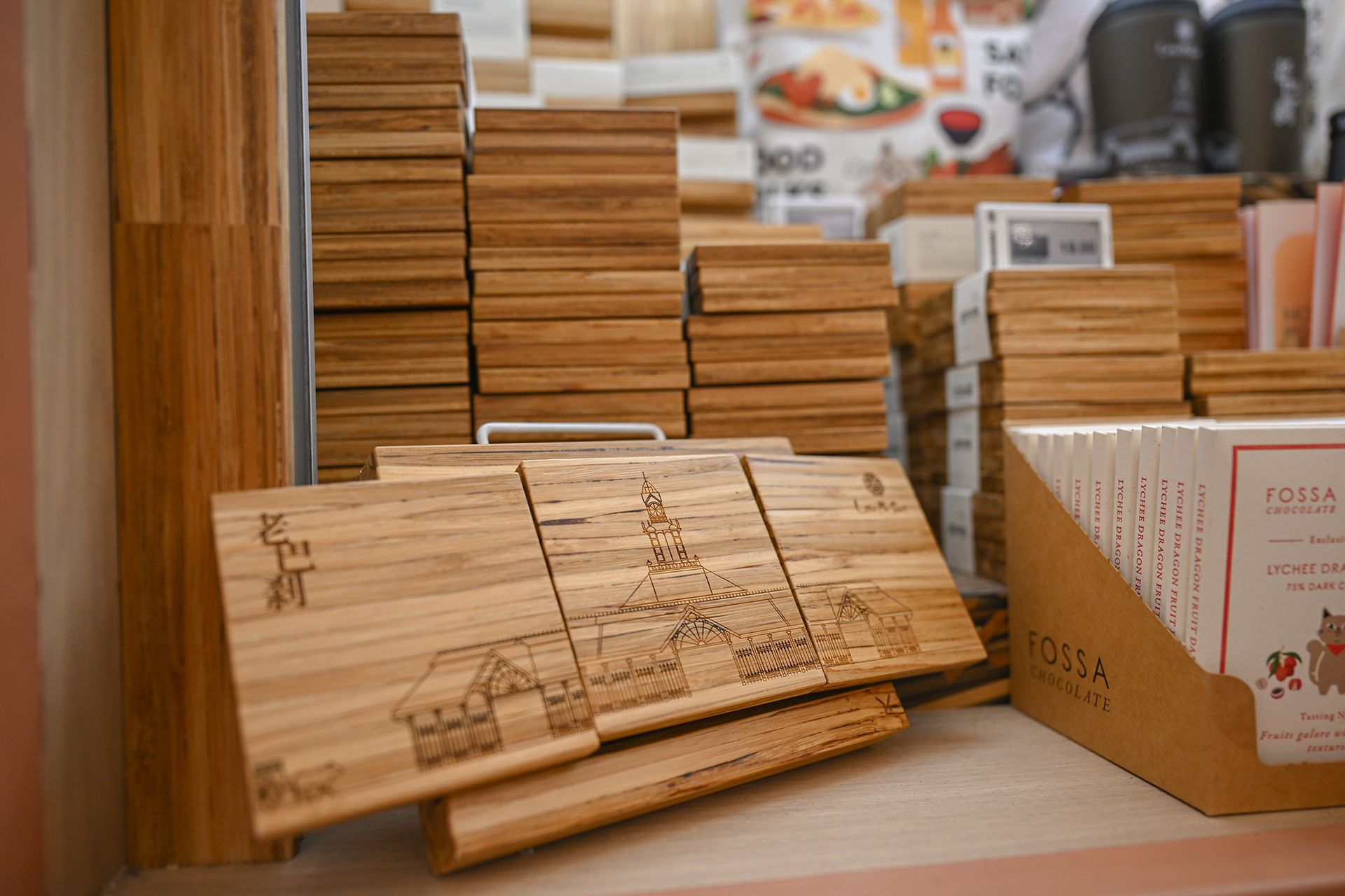 Small coasters made from wooden tiles by ChopValue being sold as souvenirs at Food Folks in Lau Pa Sat.