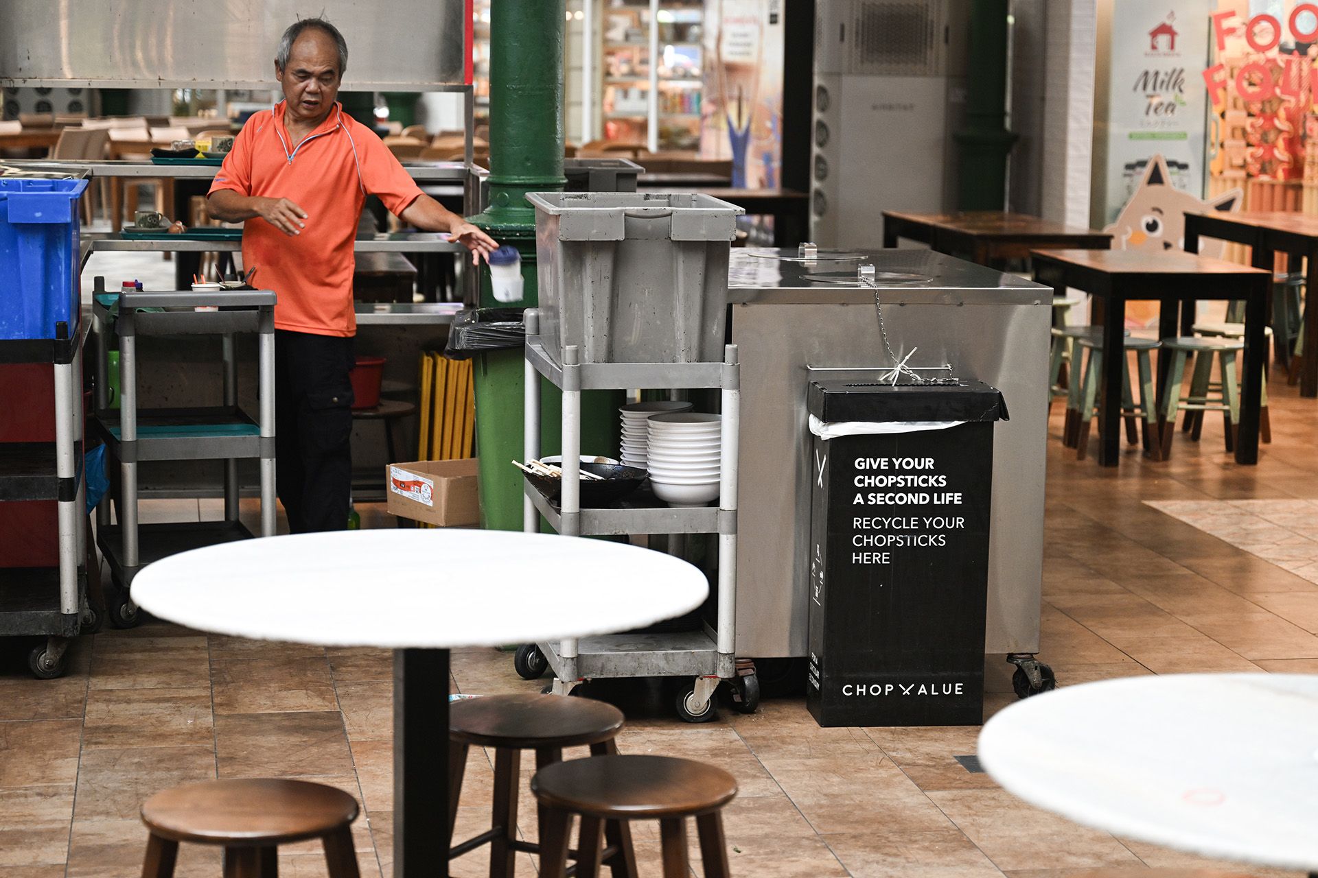 A ChopValue recycling bin at a tray return station at Lau Pa Sat. Typically, the cleaners will dispose of used chopsticks into the bin before it gets collected.