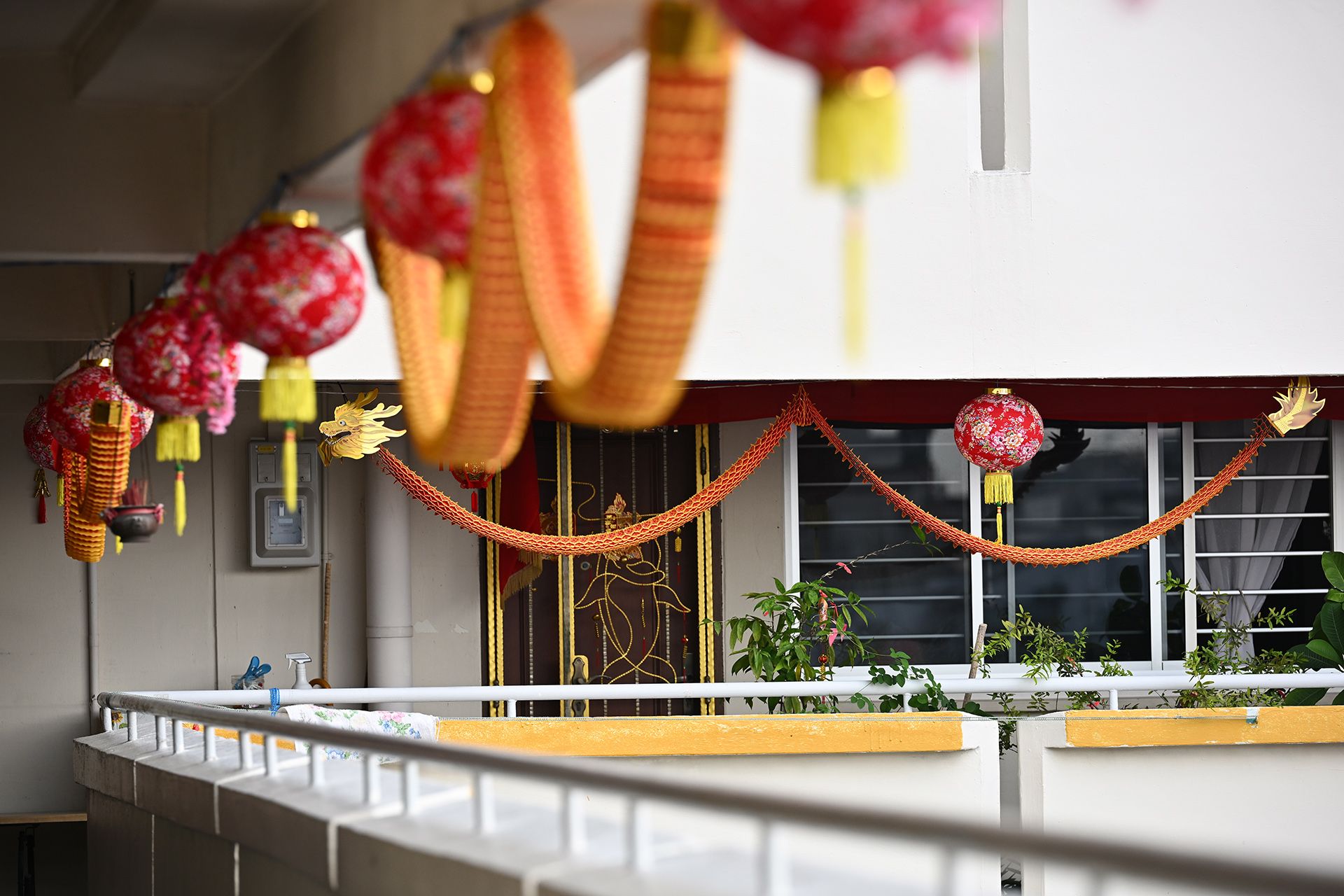 Chinese New Year decorations, including eight paper dragons and 41 lanterns on the 7th floor of Block 681 Race Course Road. They were put up by nine families, who shared the cost. The neighbours started decorating their corridors 16 years ago in 2008. ST PHOTO: LIM YAOHUI