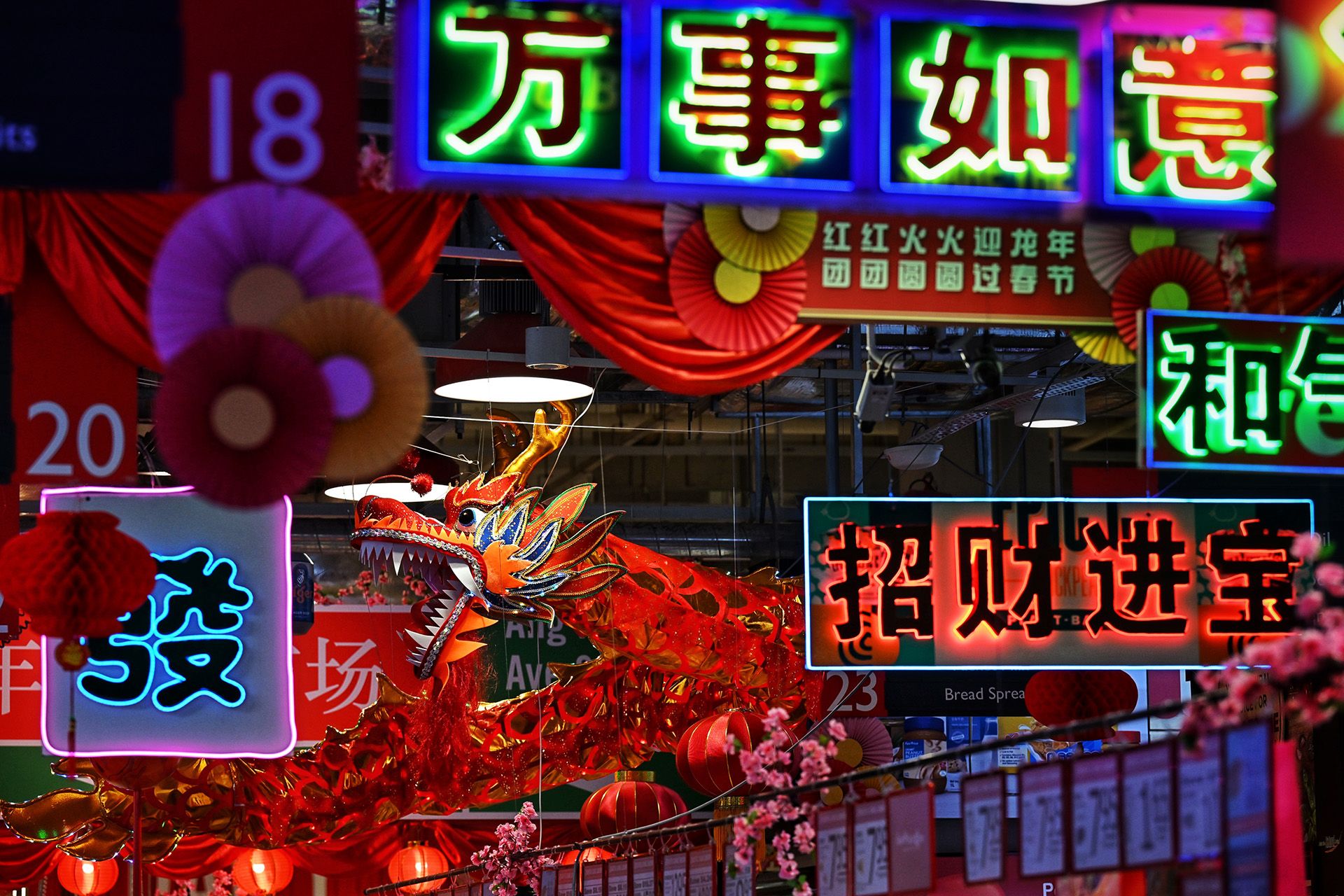 A decorative dragon perched among Chinese New Year greetings at FairPrice Xtra in AMK Hub. ST PHOTO: CHONG JUN LIANG