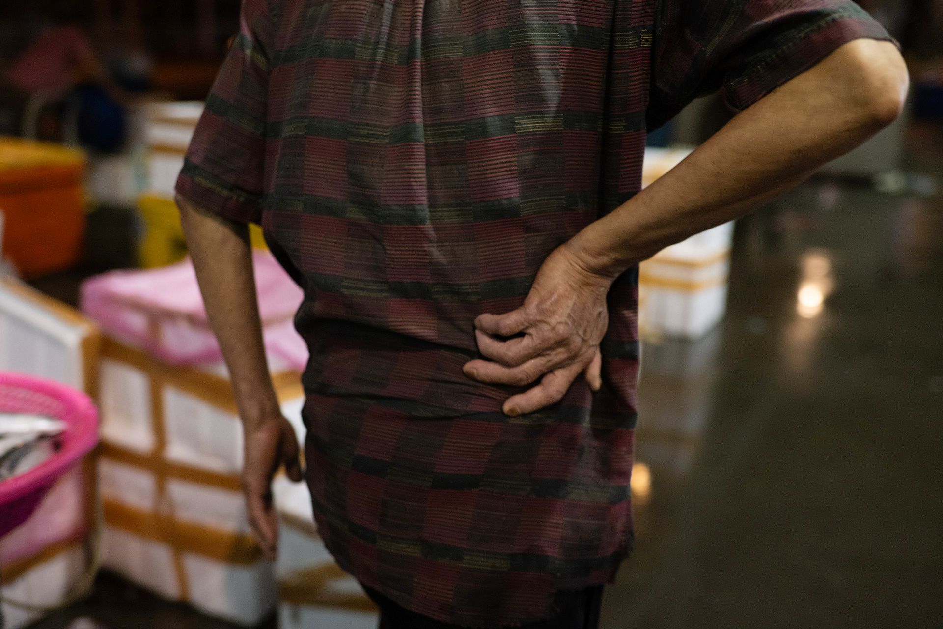 The 75-year-old taking a break from selecting fish.