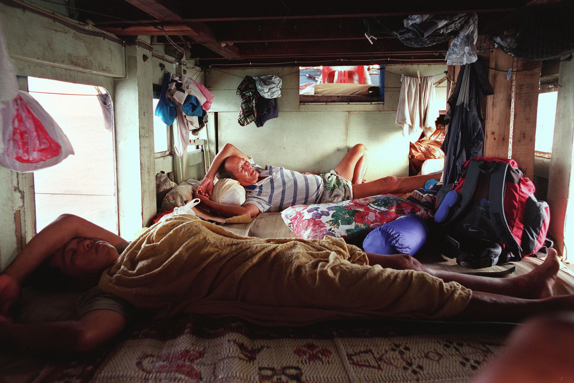 Cramped in a small bunk for four just above the engine room, tired workers would nap amid the loud engine noise. ST FILE PHOTO: CHEW SENG KIM