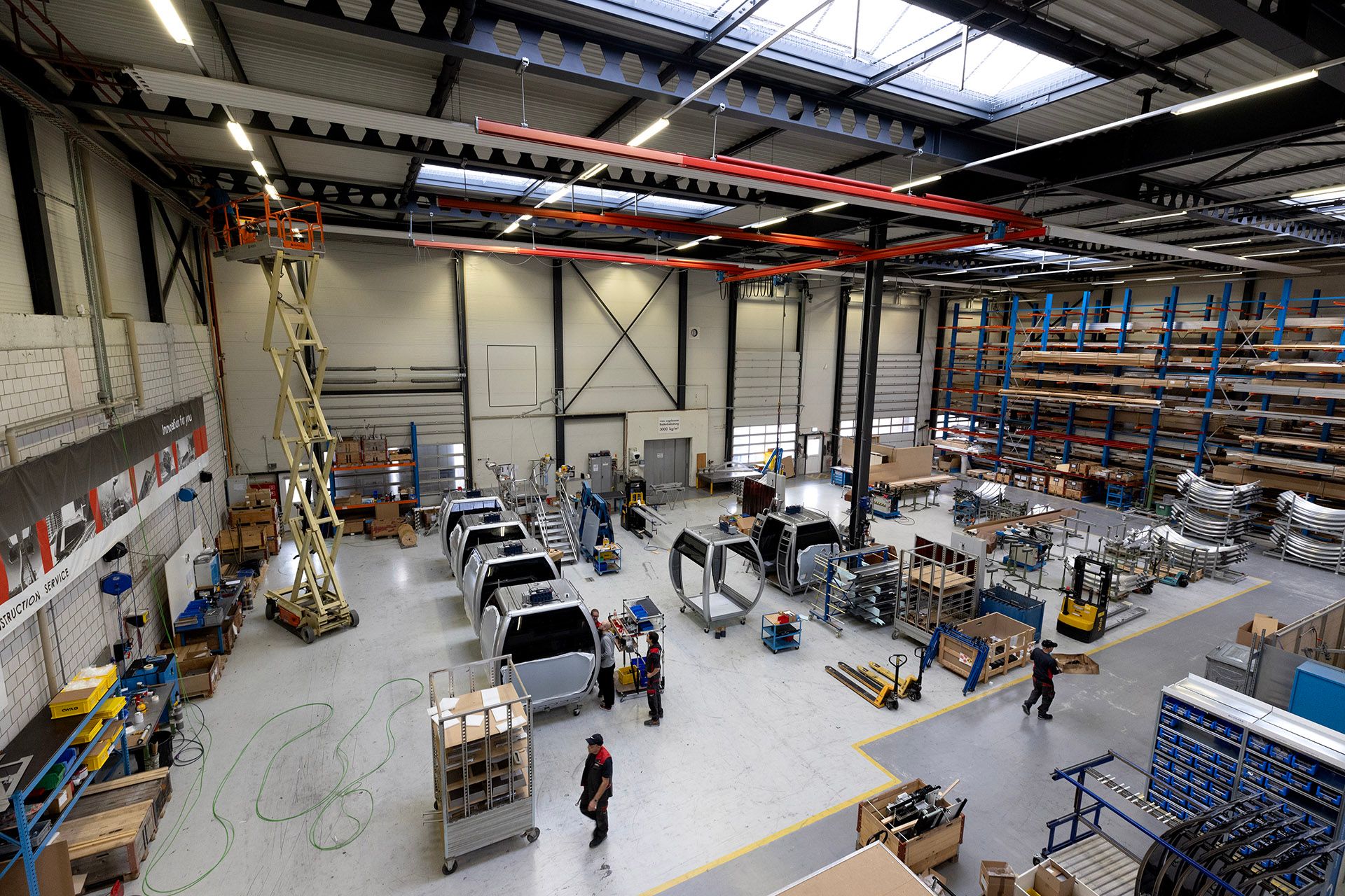 SkyOrb cabins, customised for SCC, sitting in a workshop in Olten, Switzerland, on Nov 8, 2023. Here, technicians meticulously craft and assemble components for cable car systems.