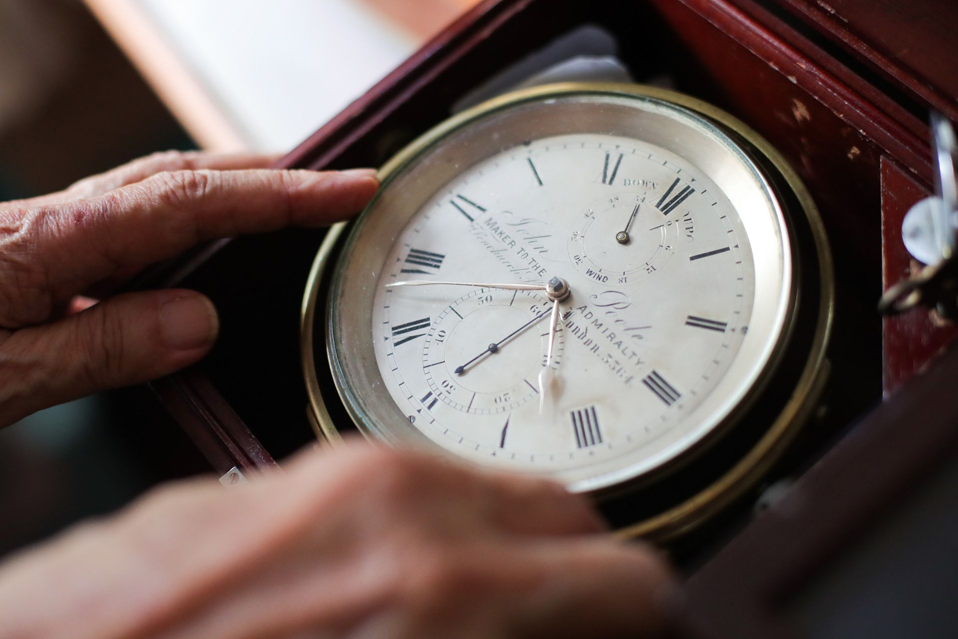 A marine chronometer made by John Poole in 1865. These expensive and very accurate instruments were required on ships, especially large merchant and military ships, to help ships navigate at sea.