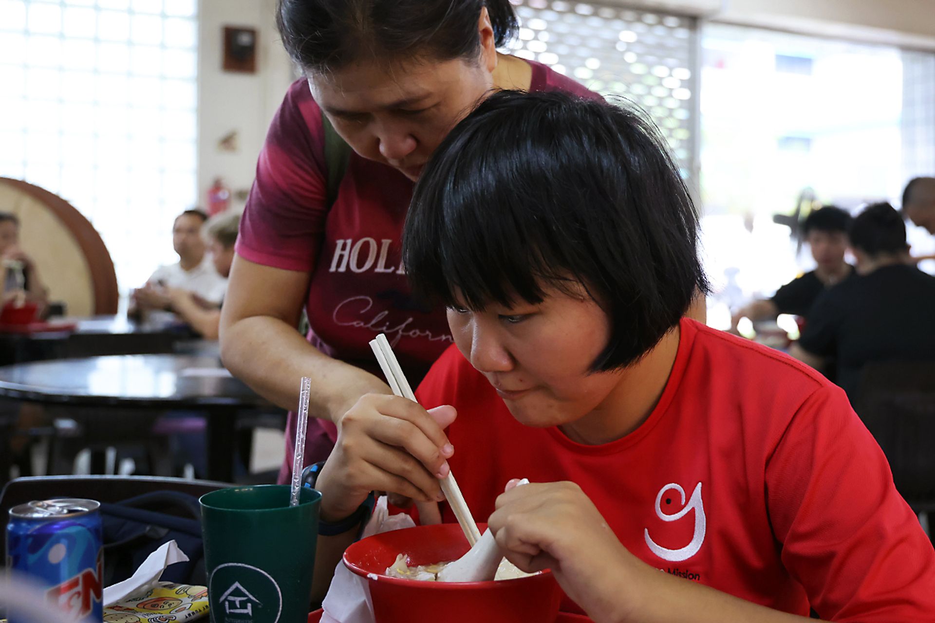 Madam Thun accompanying her daughter for lunch. Ms Lew prefers to eat at the same time every day.