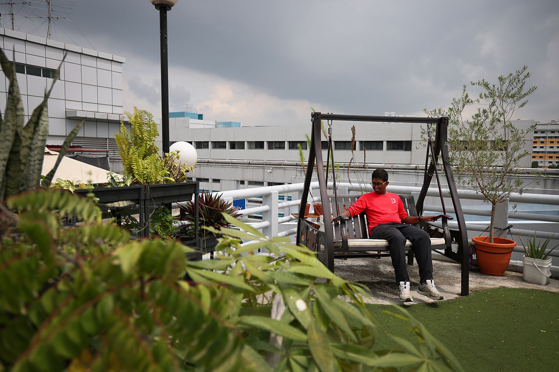 Mr Arunkumar Ashwin, 18, who has autism, resting at the therapy garden in March.