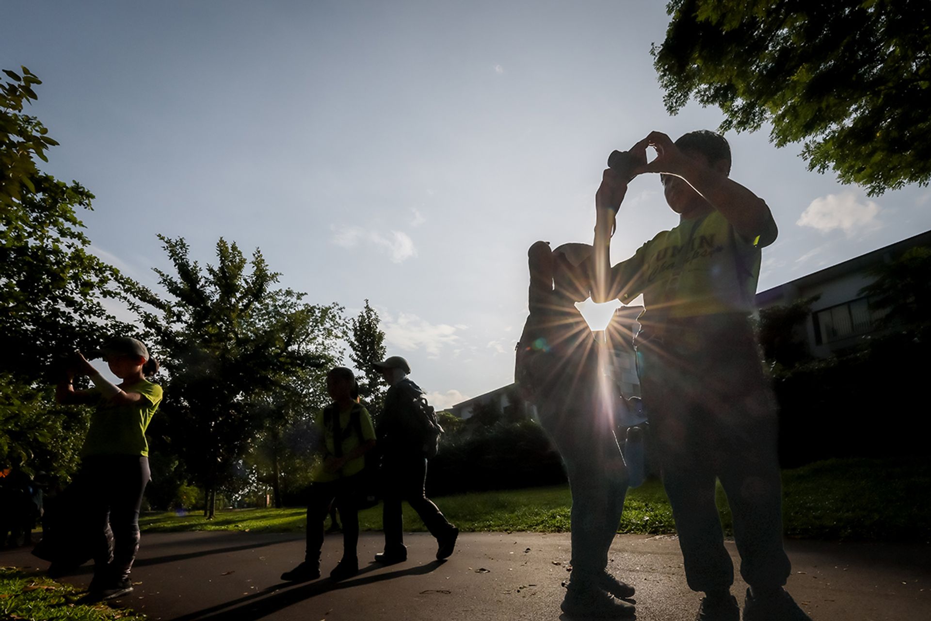 Yumin Primary pupils trying to spot animals in Pasir Ris Park.