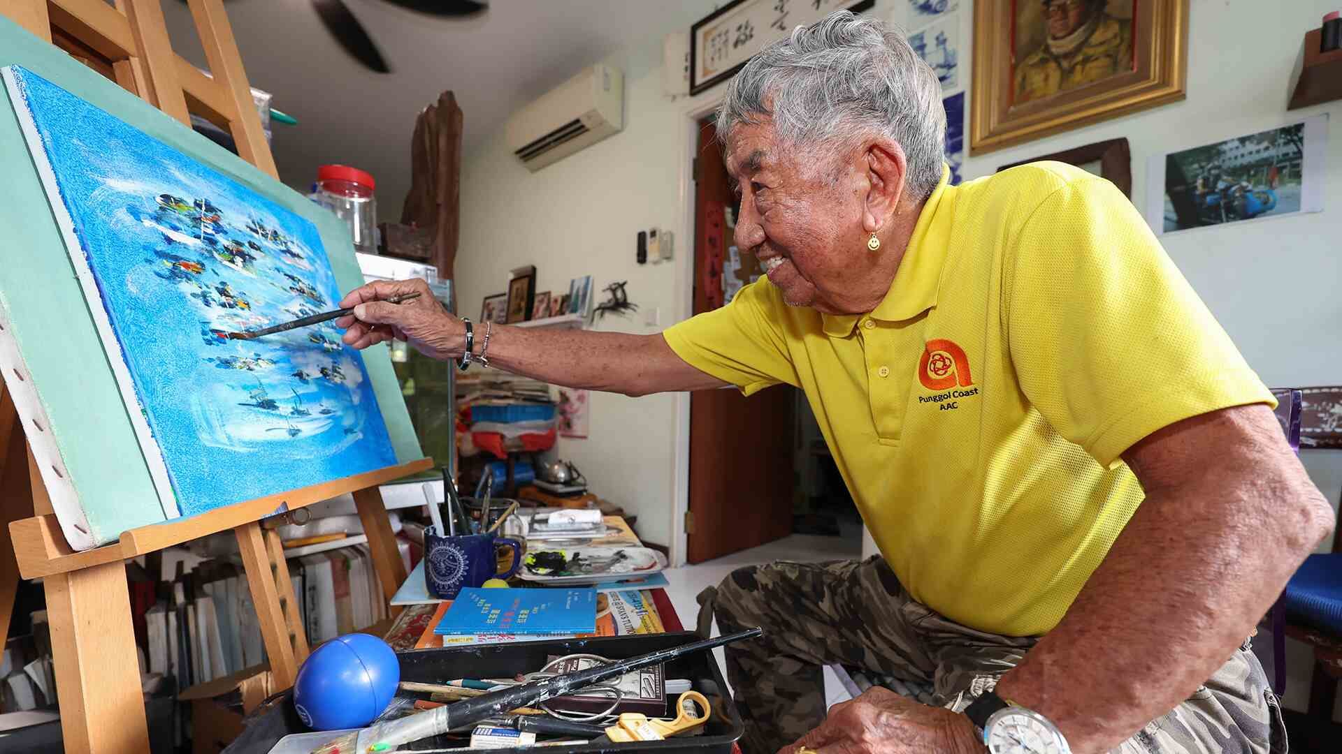 Mr Loke working on a painting at home, on May 30, 2024.